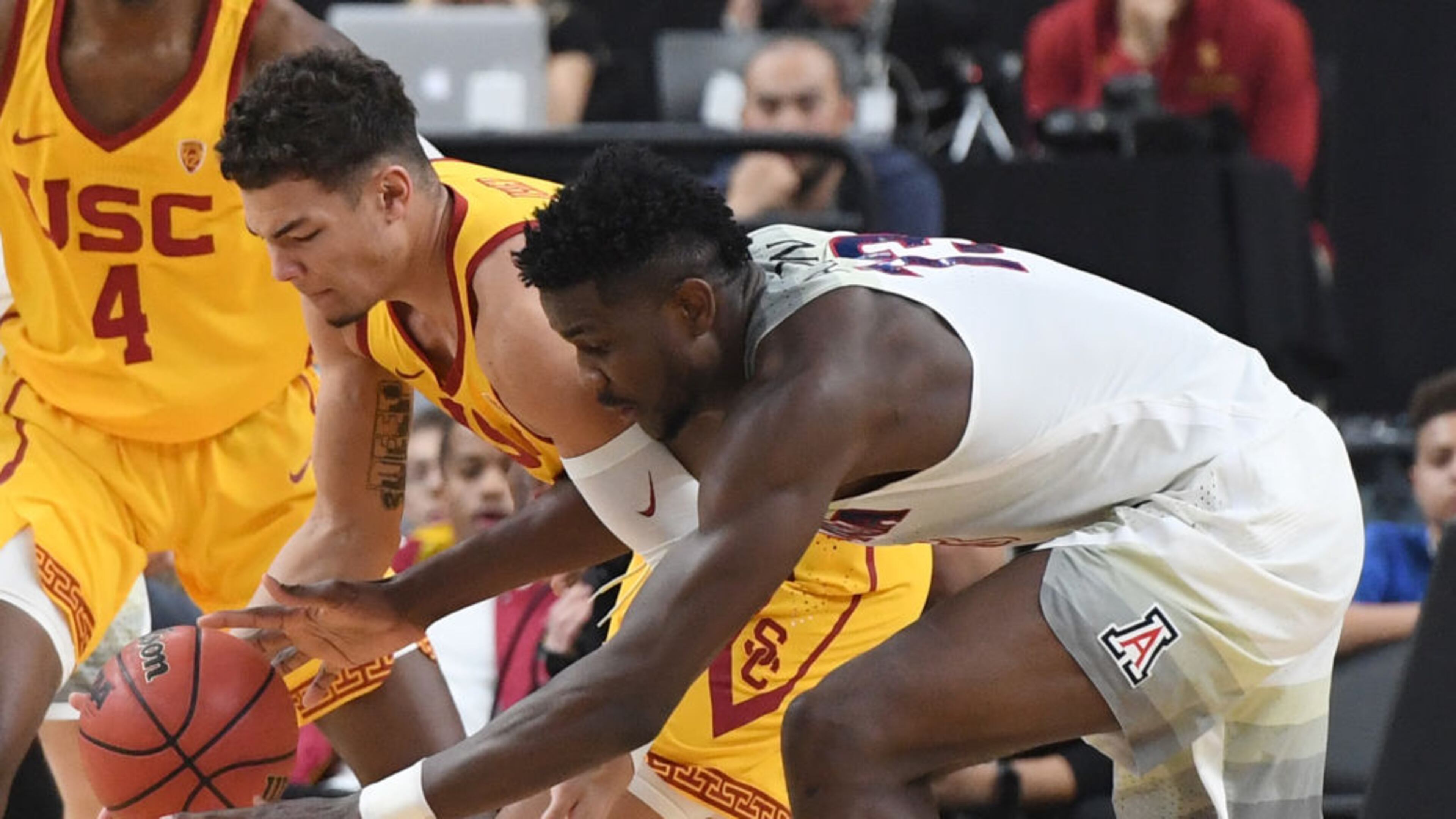 LAS VEGAS, NV - MARCH 10: Jordan Usher #1 of the USC Trojans steals the ball from Deandre Ayton #13 of the Arizona Wildcats during the championship game of the Pac-12 basketball tournament at T-Mobile Arena on March 10, 2018 in Las Vegas, Nevada. The Wildcats won 75-61. (Photo by Ethan Miller/Getty Images)