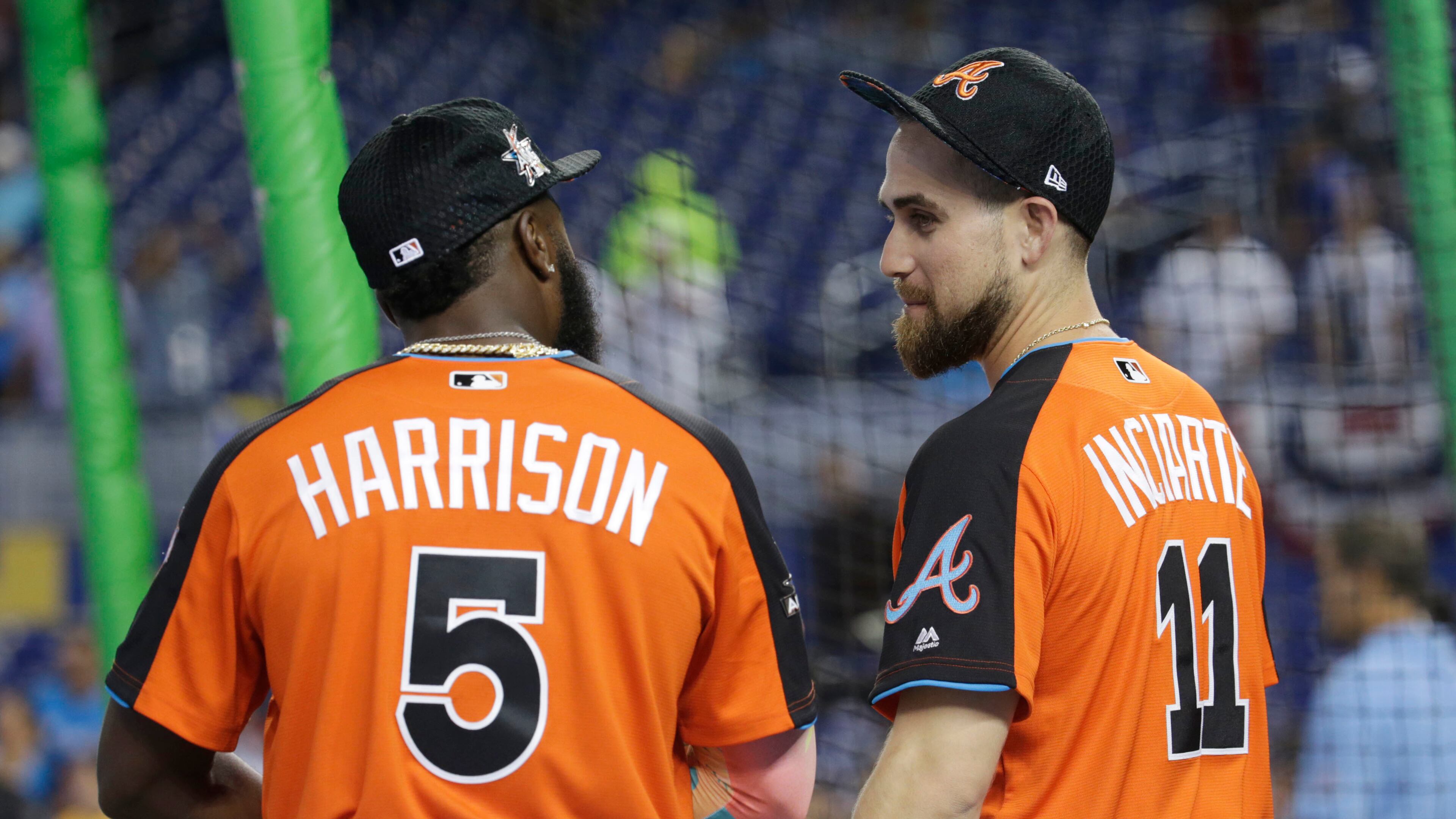 National League's Pittsburgh Pirates second baseman Josh Harrison (5) and Atlanta Braves outfielder Ender Inciarte (11), talk prior to the start of the MLB All-Star game, Tuesday, July 11, 2017, in Miami. (AP Photo/Lynne Sladky)