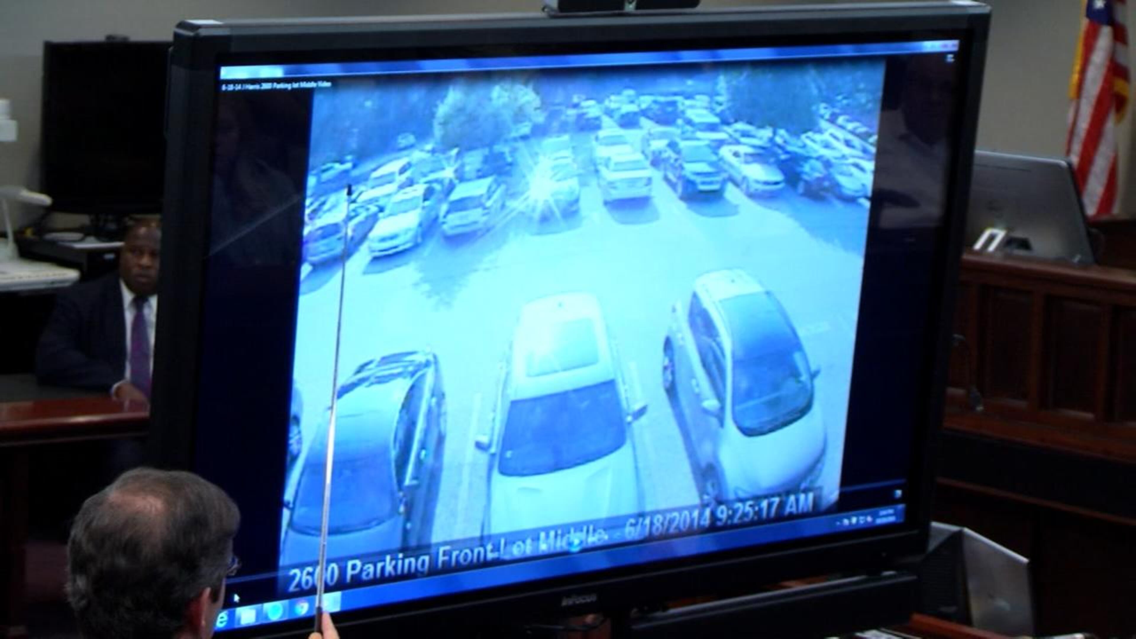Jurors are shown security footage of Justin Ross Harris' car on the day that Cooper died, during during Harris' murder trial at the Glynn County Courthouse in Brunswick, Ga., on Tuesday, Oct. 18, 2016. (screen capture via WSB-TV)