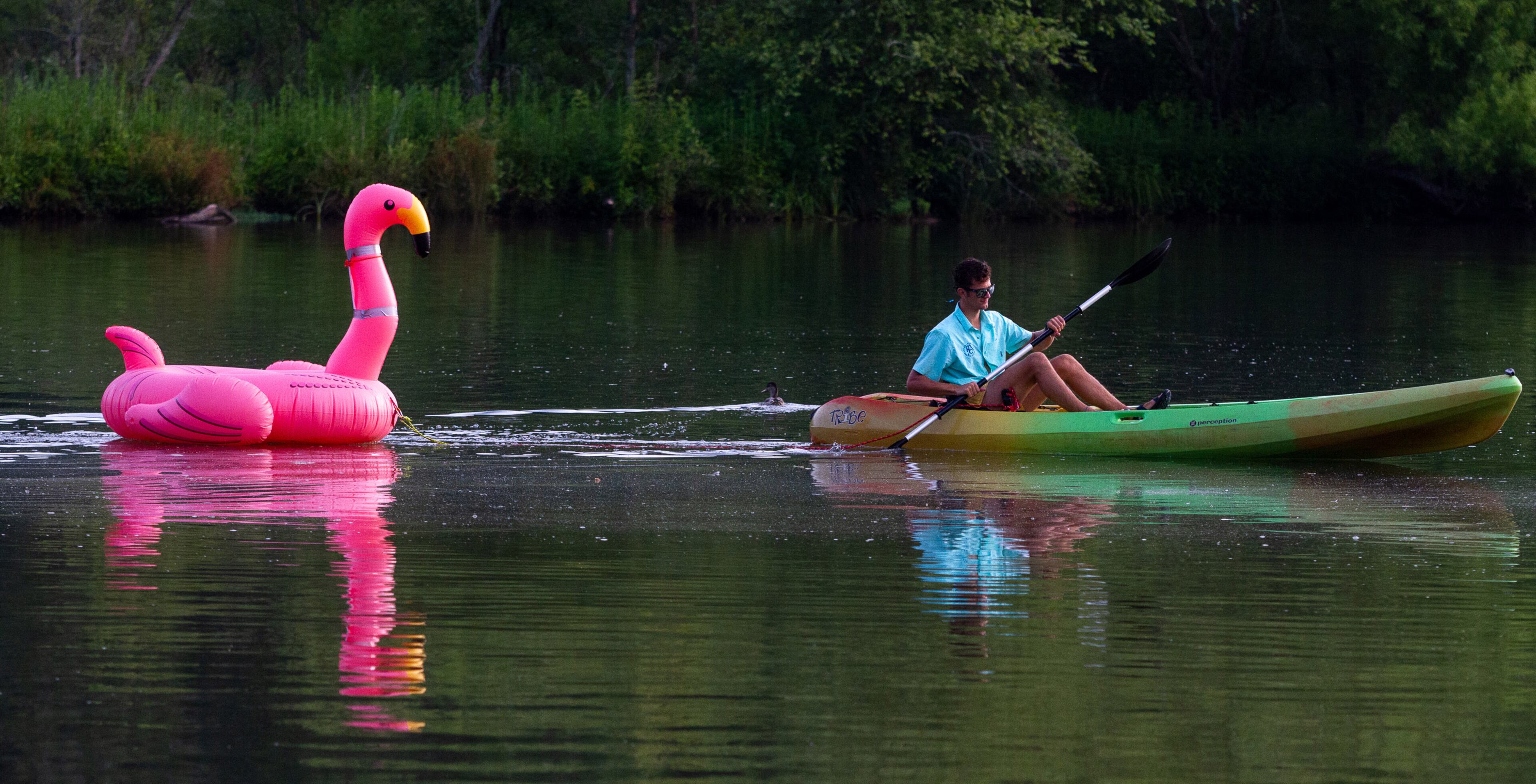 A volunteer drags a race buoy in place before the start of the 8th annual Stand Up for the Hooch at Morgan Falls Overlook Park in Sandy Springs on Sunday, June 23, 2019. STEVE SCHAEFER / SPECIAL TO THE AJC