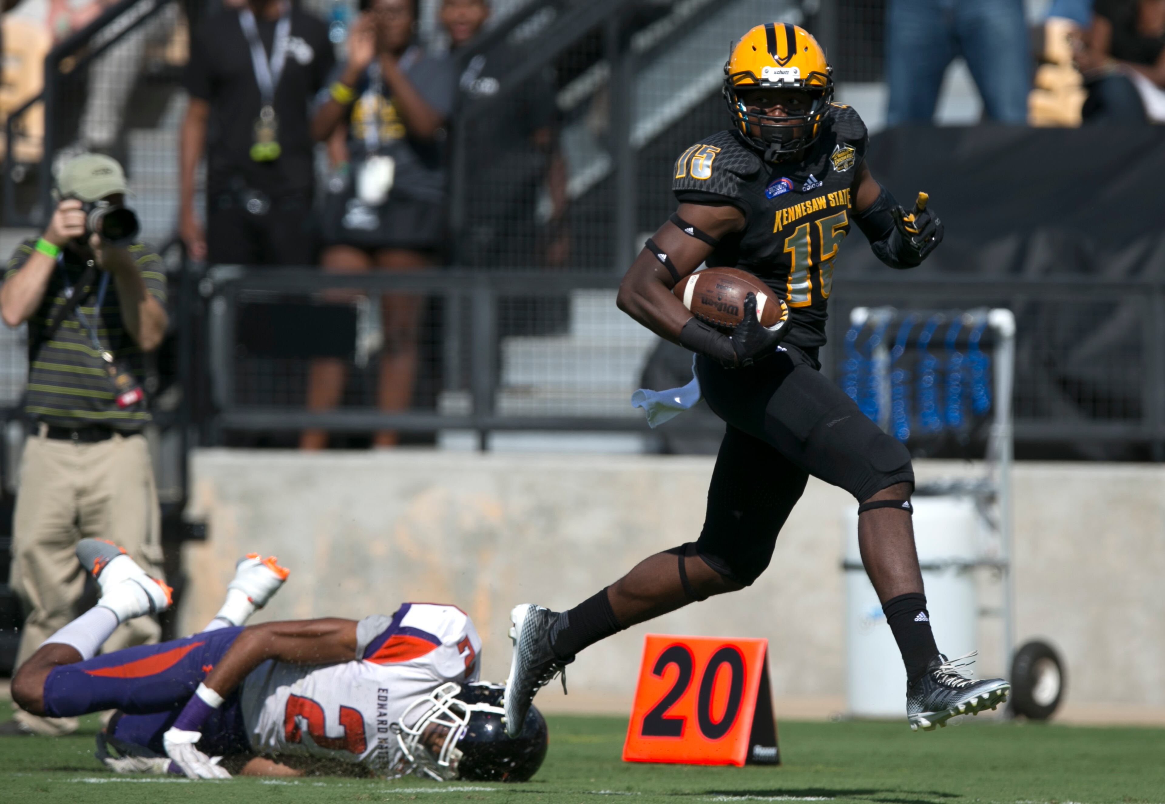September 12, 2015 - Kennesaw, Ga: Kennesaw State University wide receiver Justin Sumpter (15) gets past Edward Waters safety Deshea Hooker (2) for a touchdown reception in the first quarter of their game at Fifth Third Bank Stadium, Saturday, September 12, 2015, in Kennesaw, Ga.. This is the first home game of KSU's inaugural football season. PHOTO / JASON GETZ