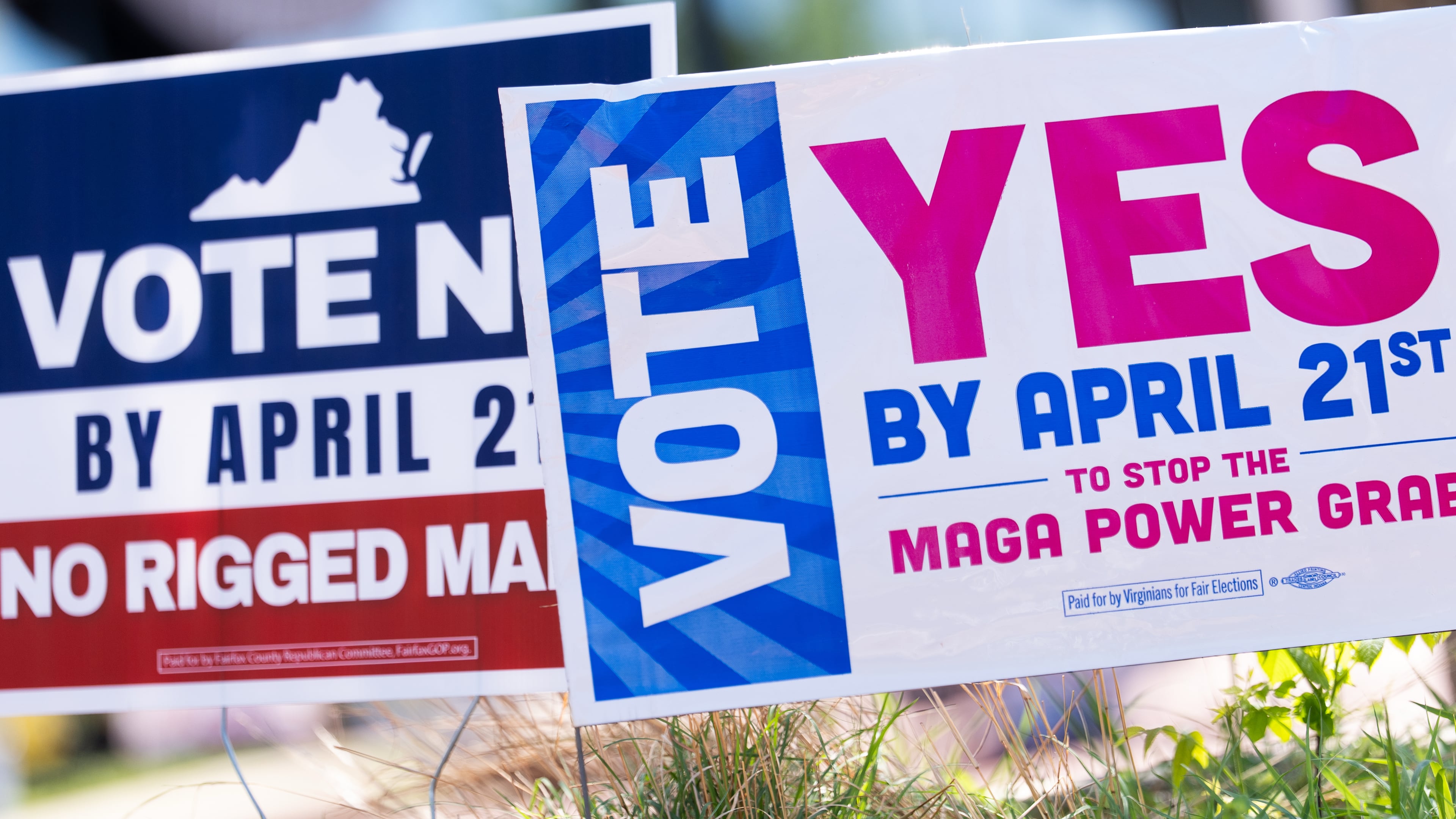 Signs are seen outside Fairfax Government Center during the Virginia redistricting referendum, Tuesday, April 21, 2026, in Fairfax, Va. (AP Photo/Julia Demaree Nikhinson)