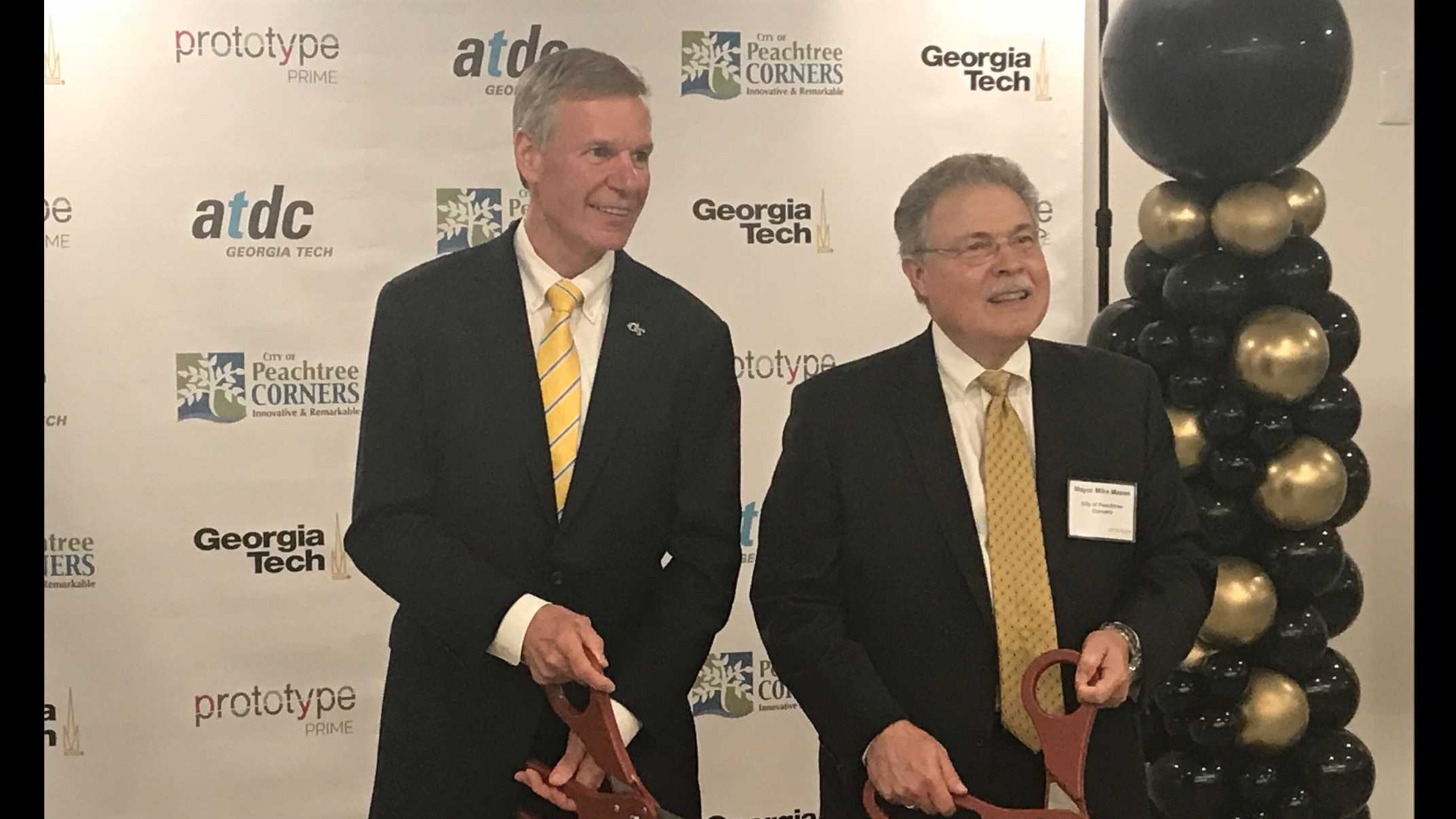 Georgia Tech president G.P. "Bud" Peterson (left) and Peachtree Corners Mayor Mike Mason (right) at a ribbon-cutting ceremony on Thu., Aug. 2, 2018 to unveil a bootcamp program that will begin in the city in January 2019. ERIC STIRGUS / ESTIRGUS@AJC.COM