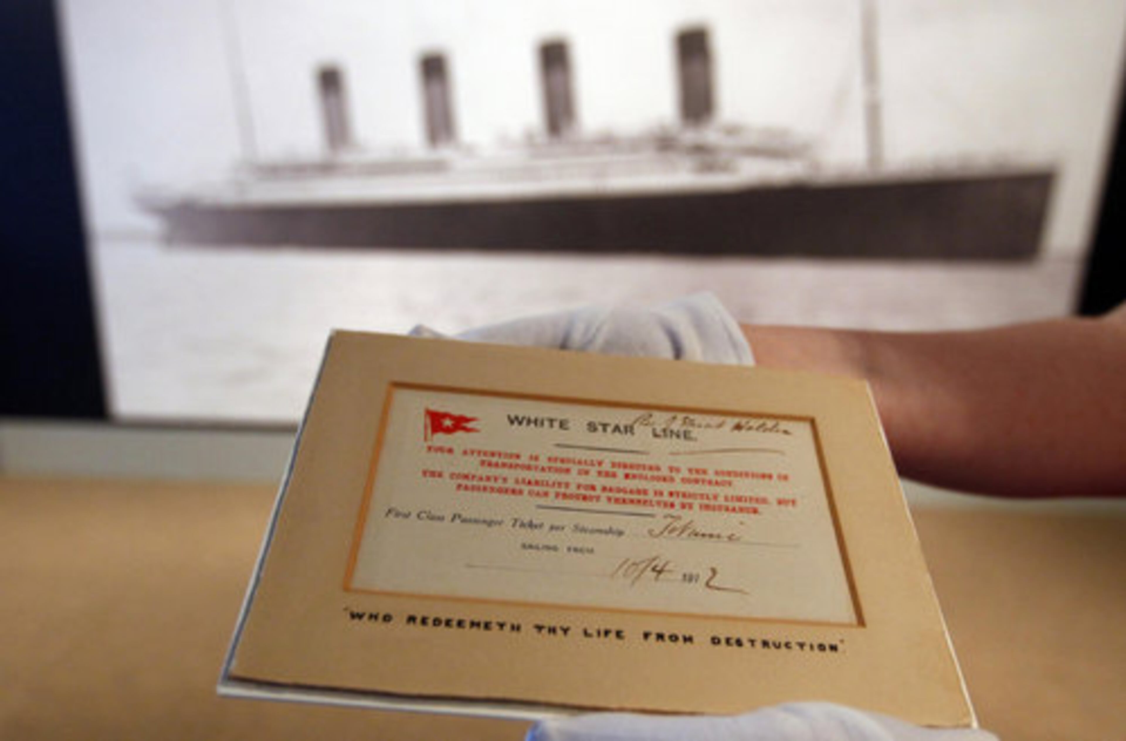 Curator Dawn Littler holds the only known surviving first class ticket from the Titanic, at the Merseyside Maritime Museum in Liverpool. The ticket, which belonged to Reverend Stuart Holden, is on display at the exhibition "Titanic and Liverpool: The Untold Story," which marks the 100th anniversary of the sinking of the ship. Reverend Holden cancelled his trip aboard the Titanic after his wife fell ill the day before they were due to set sail.