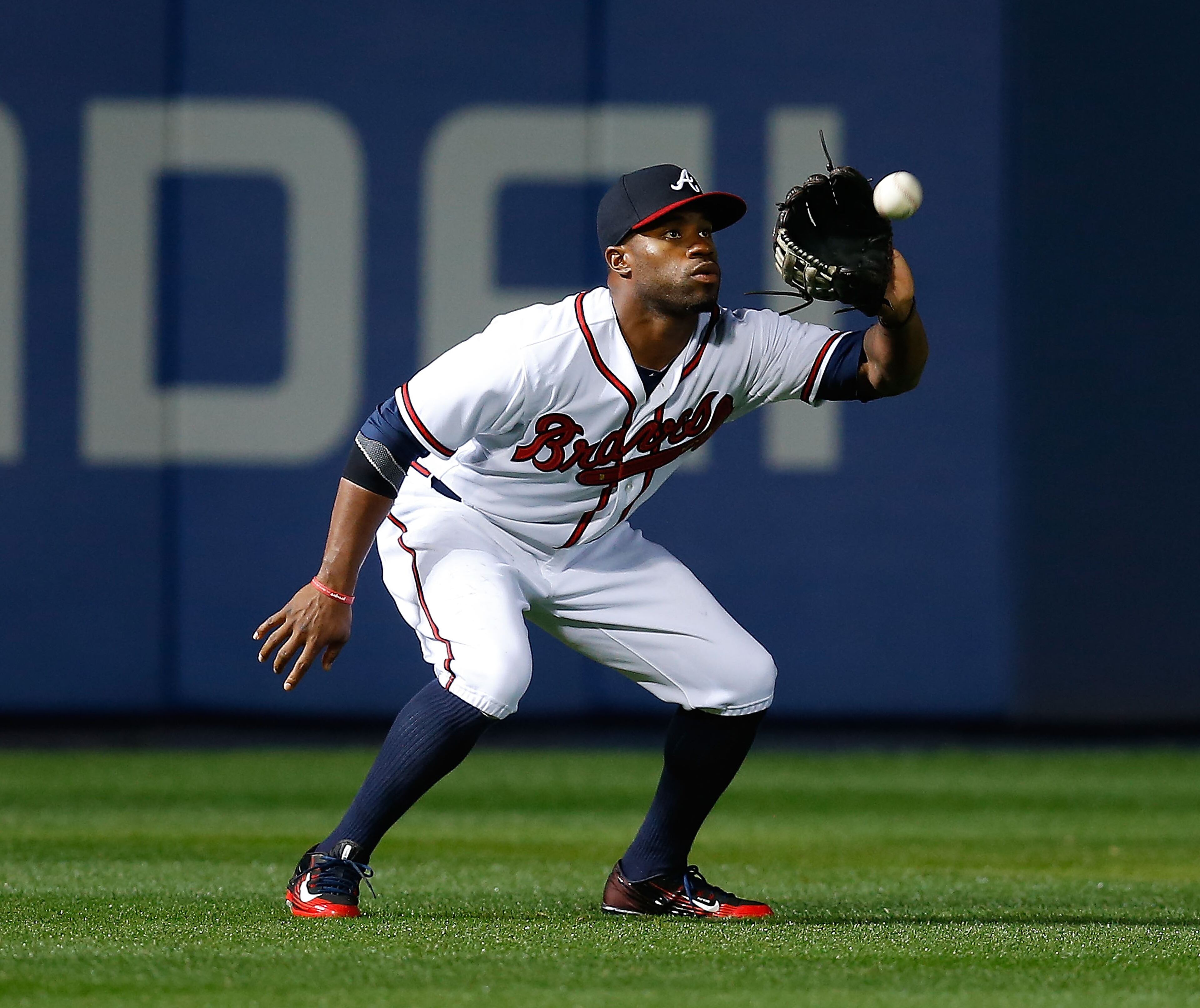 Left fielder Eric Young Jr. of the Atlanta Braves catches a fly ball during the game against the Miami Marlins at Turner Field on April 13, 2015, in Atlanta.