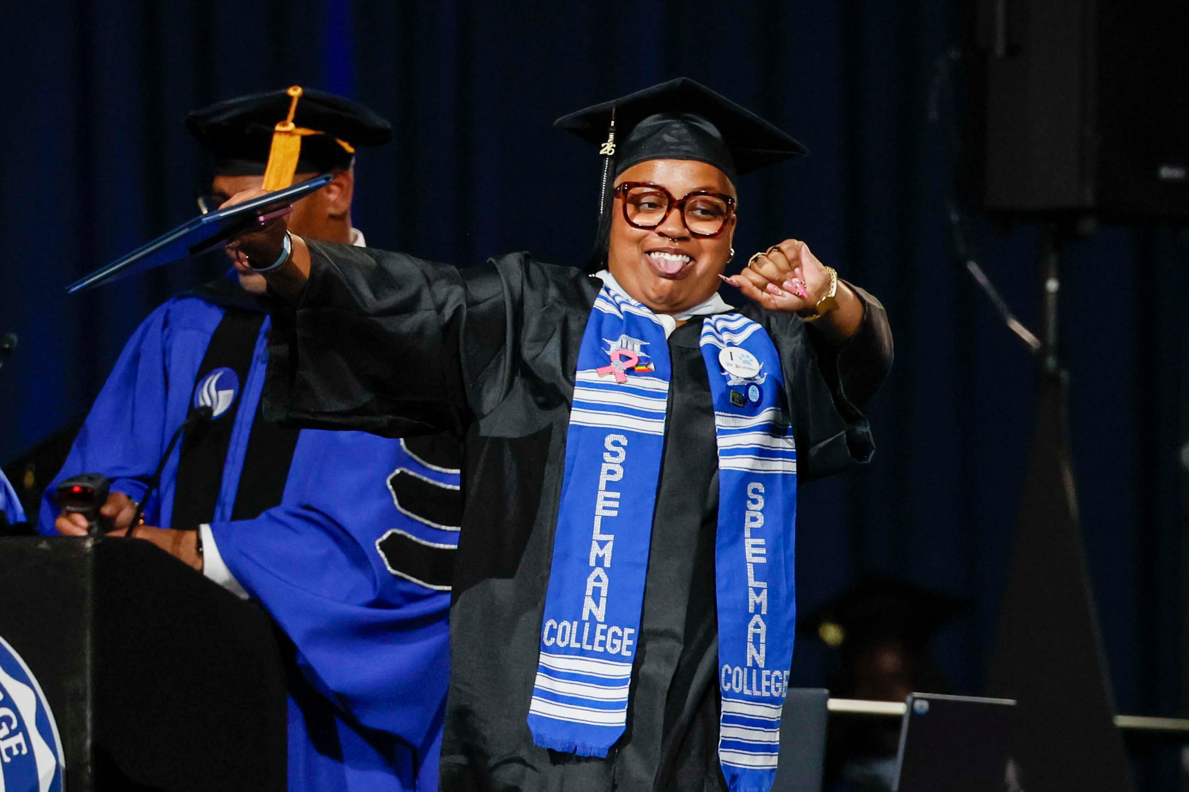 A graduate reacts after receiving her diploma during the Spelman College Commencement at the Georgia International Convention Center in College Park on Sunday, May 17, 2026. (Miguel Martinez/AJC)