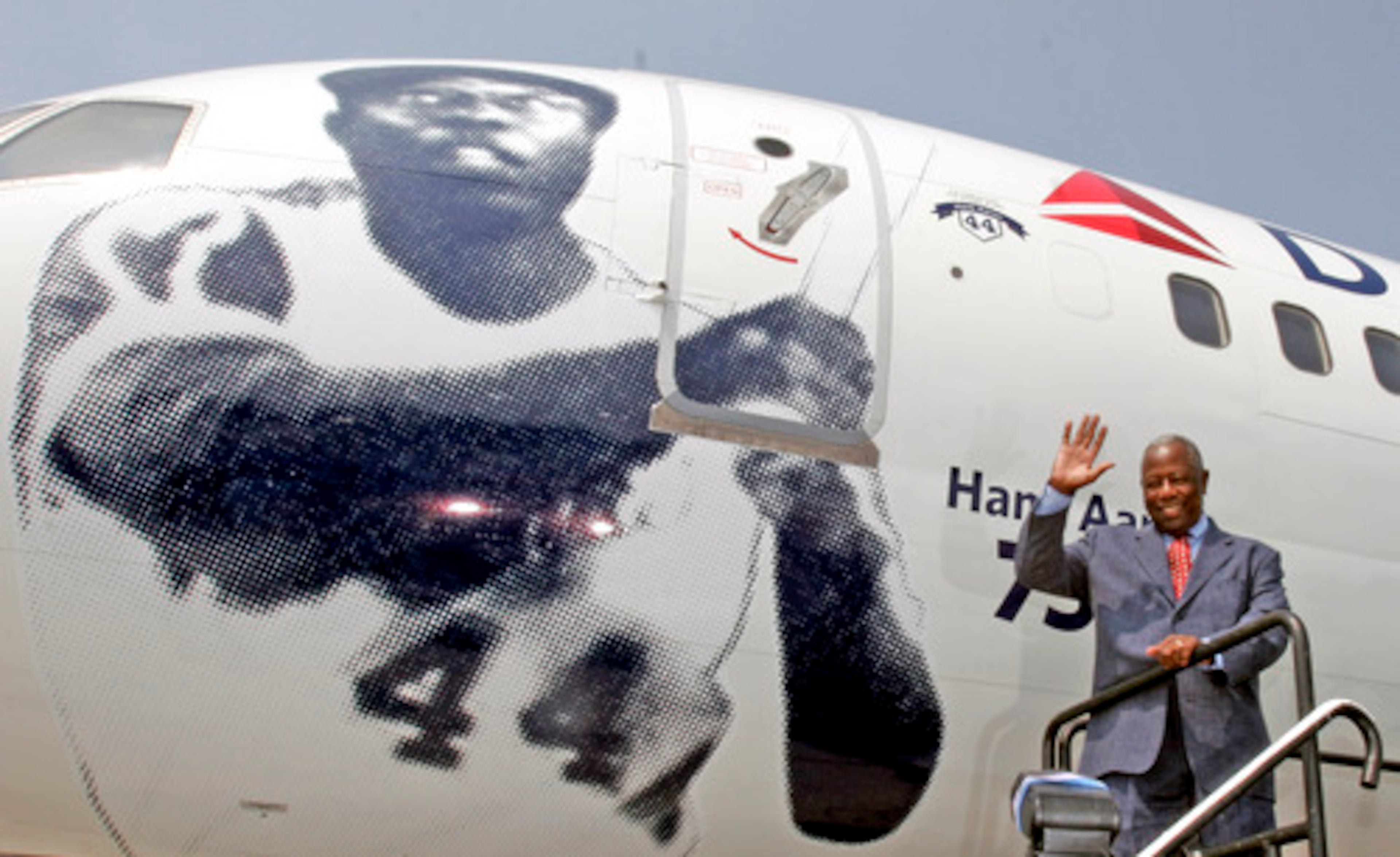 Braves legend Hank Aaron waves to the crowd after unveiling a Delta Air Lines "signature aircraft--The Hank Aaron 755" -- June 18, 2007, in Atlanta.