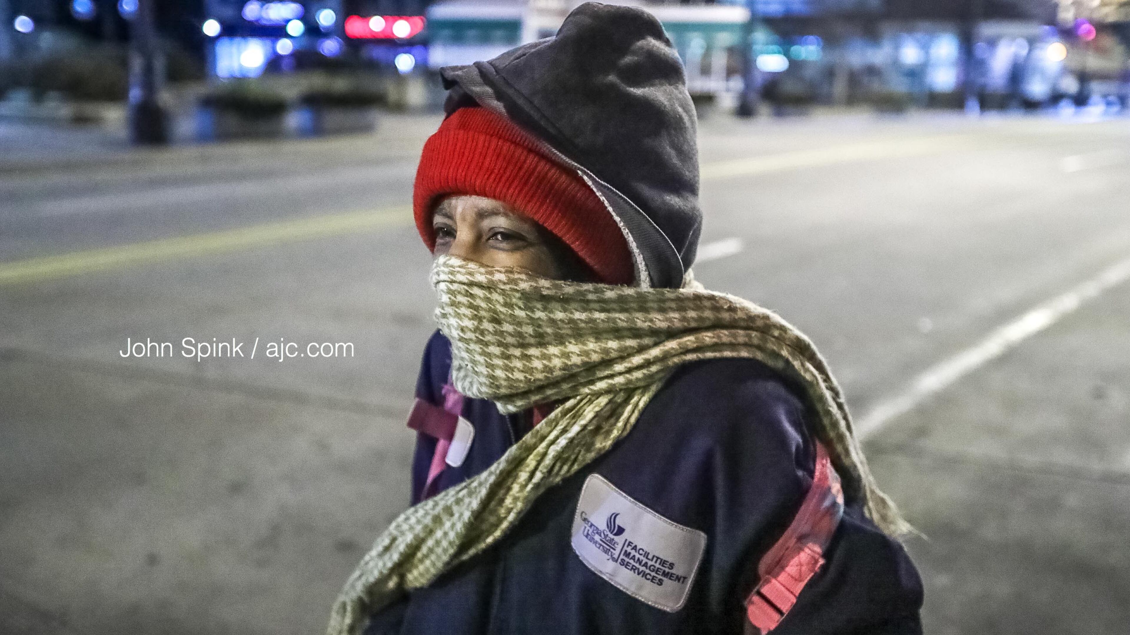 With temperatures in the 20s Tuesday morning, Corine Riley made sure to bundle up as she stood on Peachtree and Wall streets in downtown Atlanta.