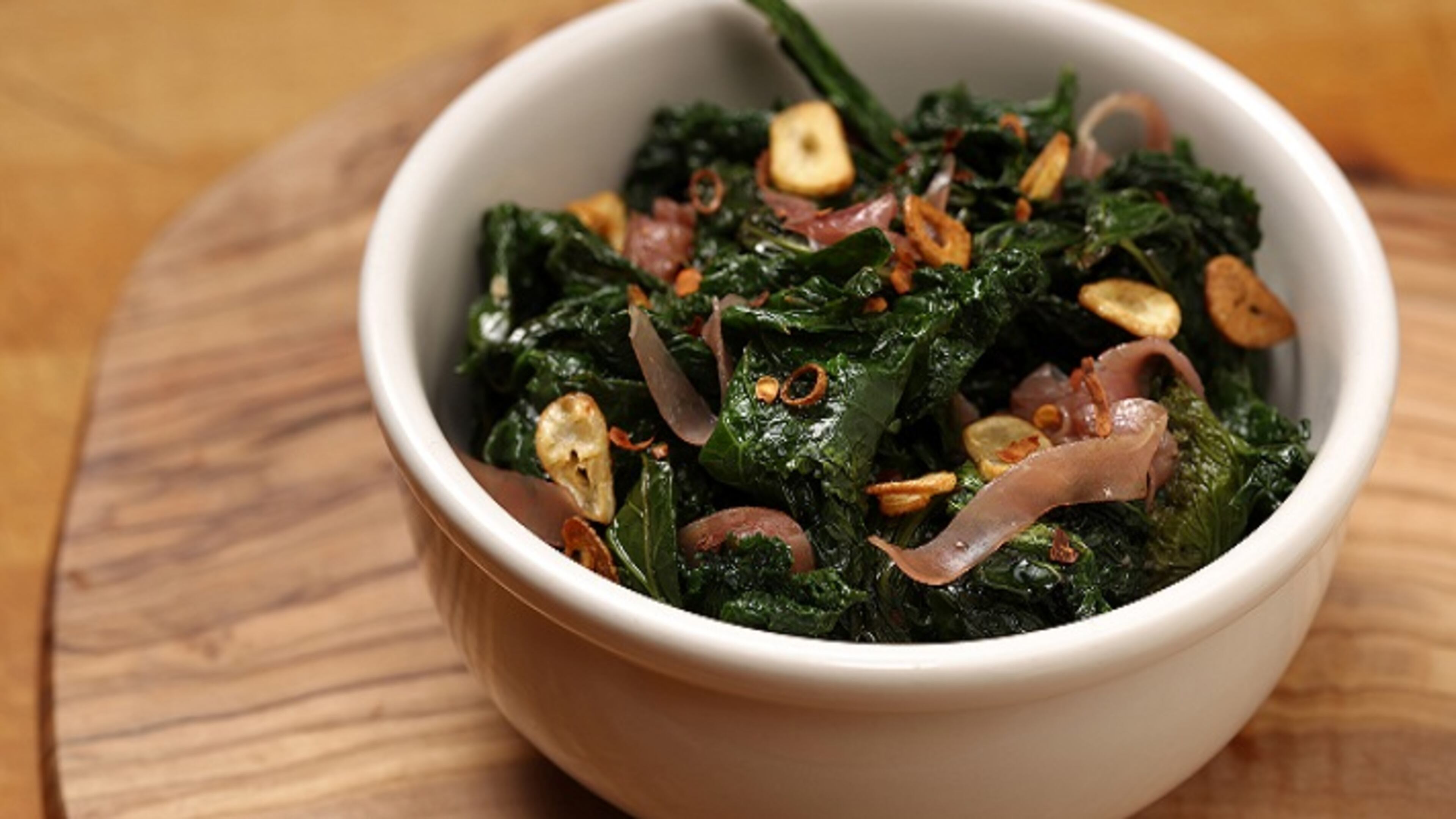 A balsamic syrup, made by cooking down vinegar, helps tame the bite of mustard greens. (Food styling by Joan Moravek.) (E. Jason Wambsgans/Chicago Tribune/TNS)