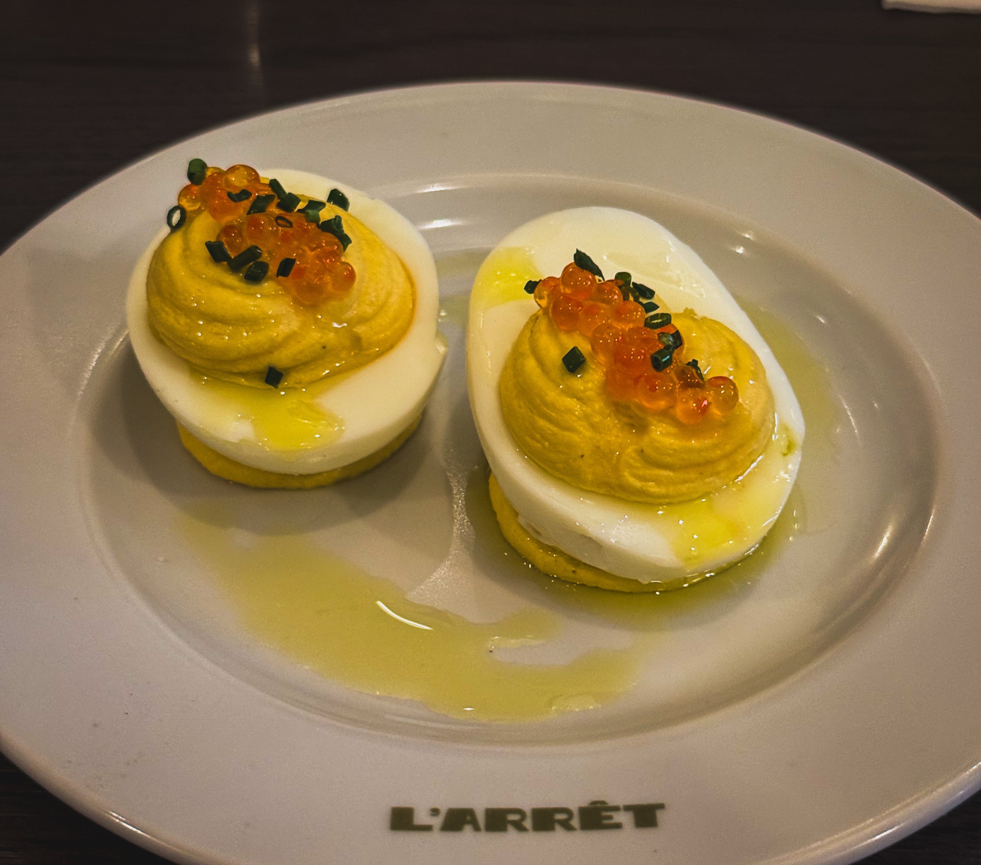 Deviled eggs made with smoked fish and trout roe at L'Arret by the Grey. (Henri Hollis/AJC)