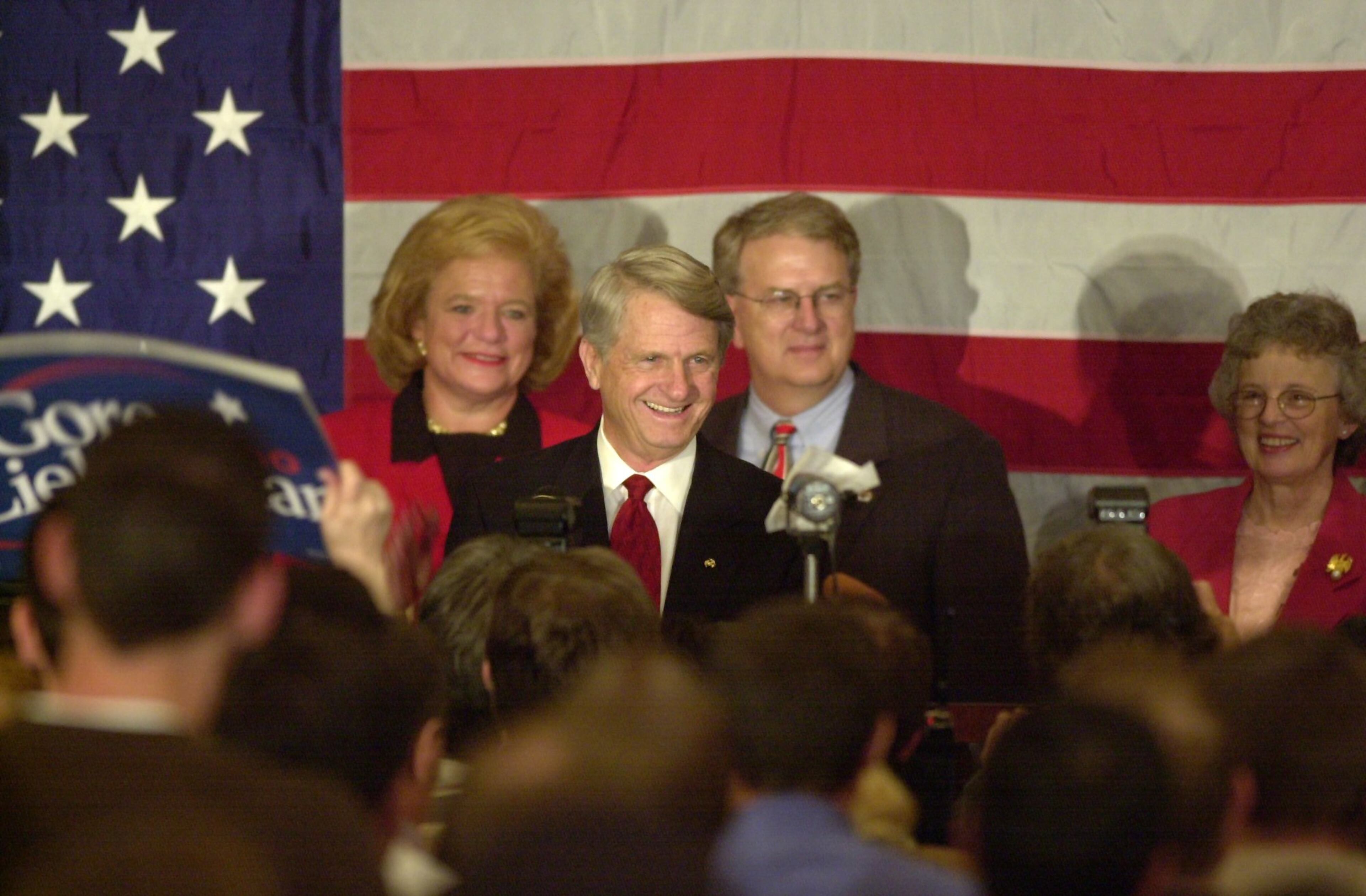 001107 ATLANTA: A happy Zell Miller (C,cq), backed by his wife Shirley (R,cq), Georgia Gov. Roy Barnes (C-R,cq) and first lady Marie (L,cq) addresses a crowd of energetic supporters after claiming victory in his senatorial race against Mack Mattingly after midnight Wednesday 11/8/00 at the Democratic victory party at Colony Square Hotel. (DAVID TULIS/Staff)