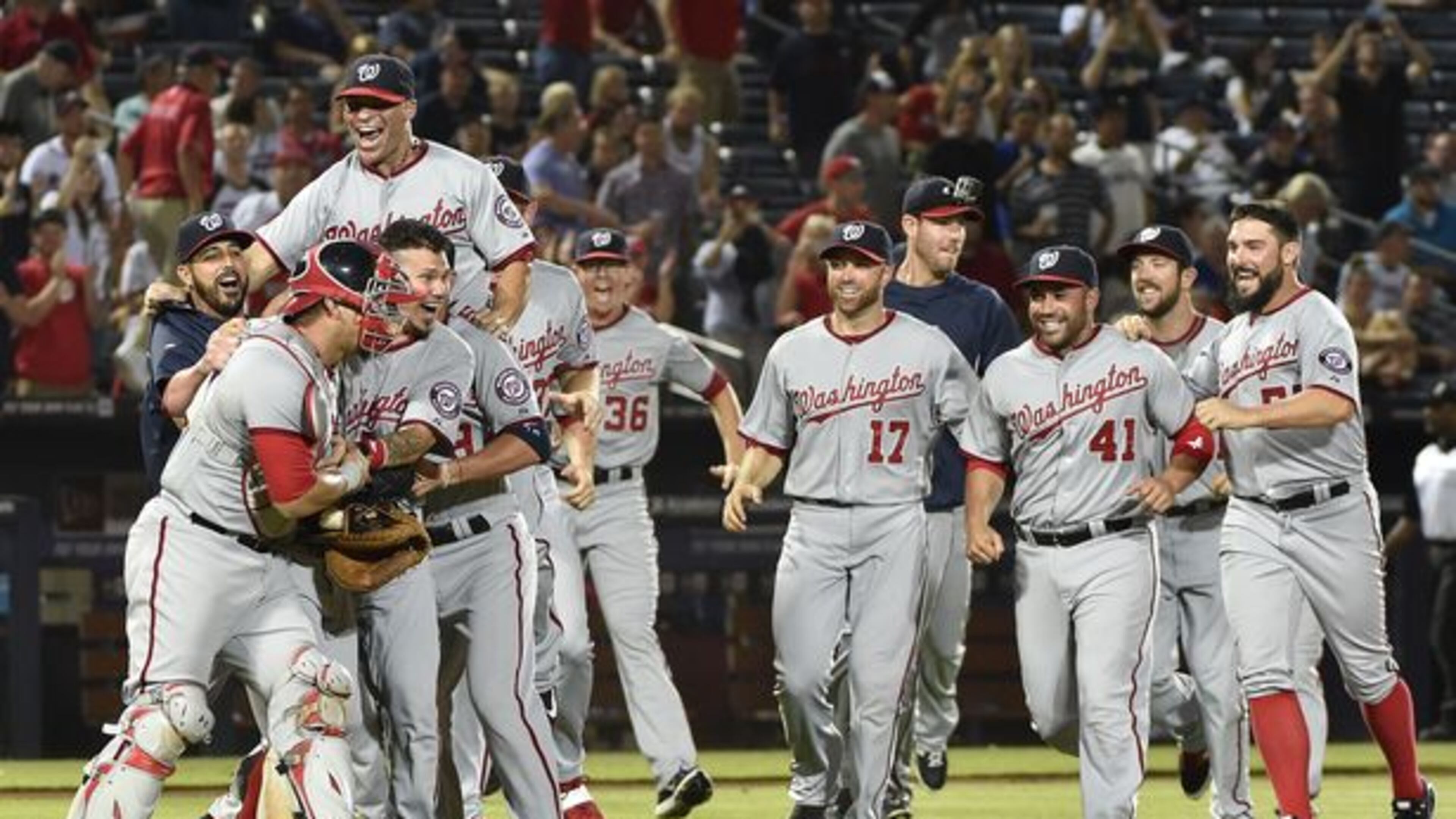 The Nationals celebrated winning the NL East title Tuesday night at Turner Field, the latest indignation for the skidding Braves.