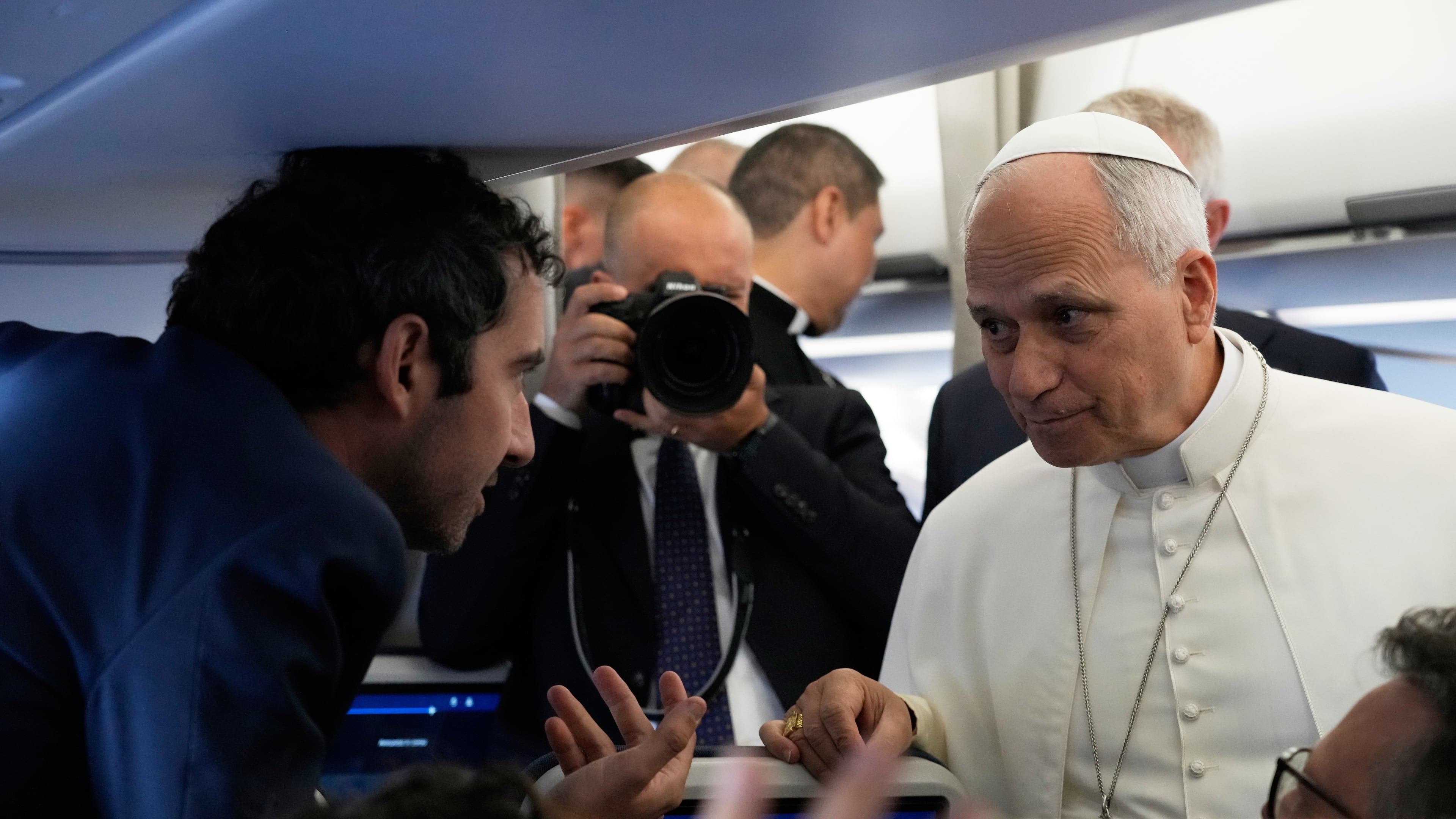Pope Leo XIV talks to journalists aboard the papal flight from Rome to Paris, Friday, Sept. 25, 2026, during his apostolic journey to France. (AP Photo/Gregorio Borgia, Pool)