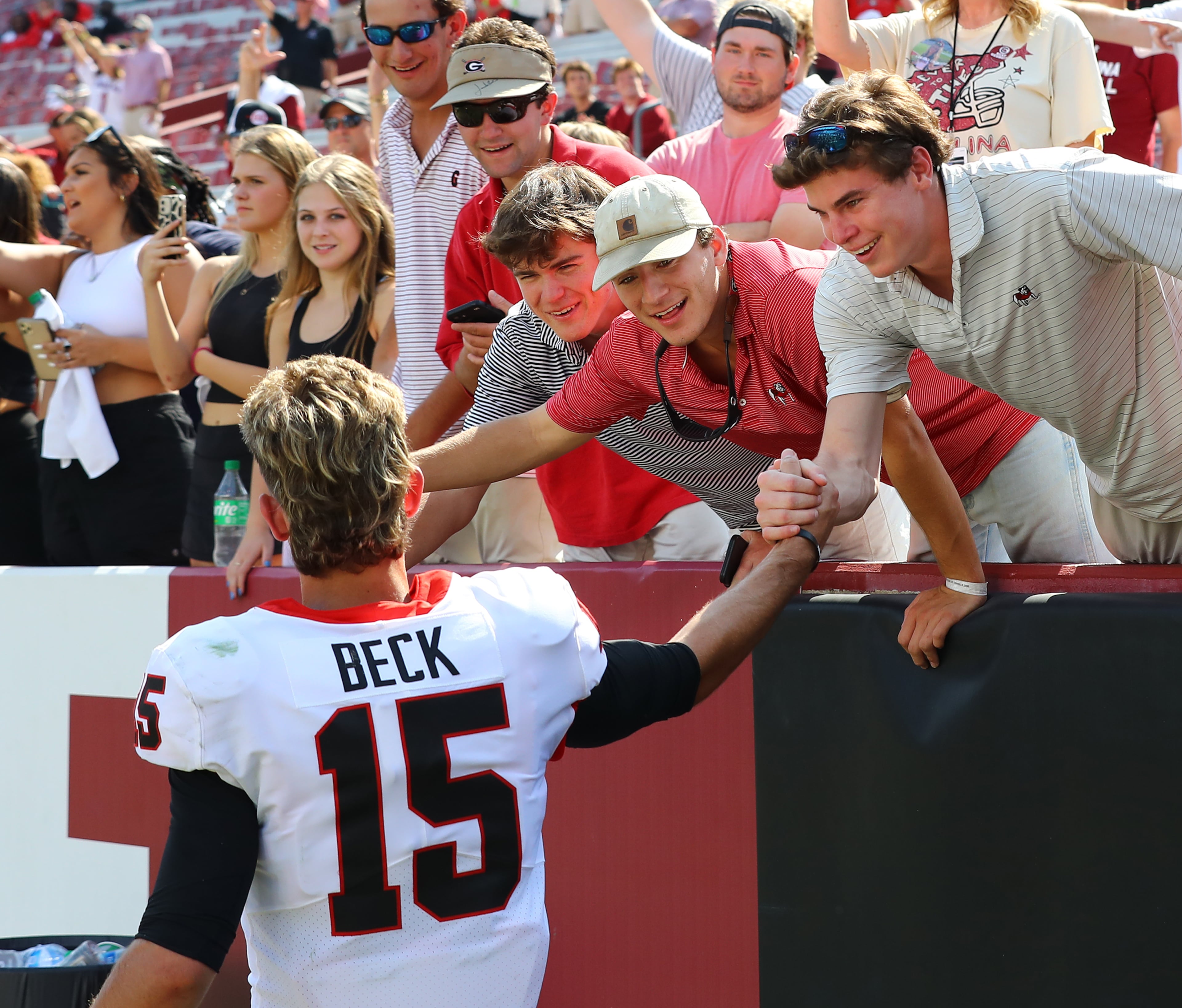 Georgia quarterback Carson Beck celebrates with fans after the Bulldogs beat South Carolina 48-7 in a NCAA college football game on Saturday, Sept. 17, 2022, in Columbia. “Curtis Compton / Curtis Compton@ajc.com