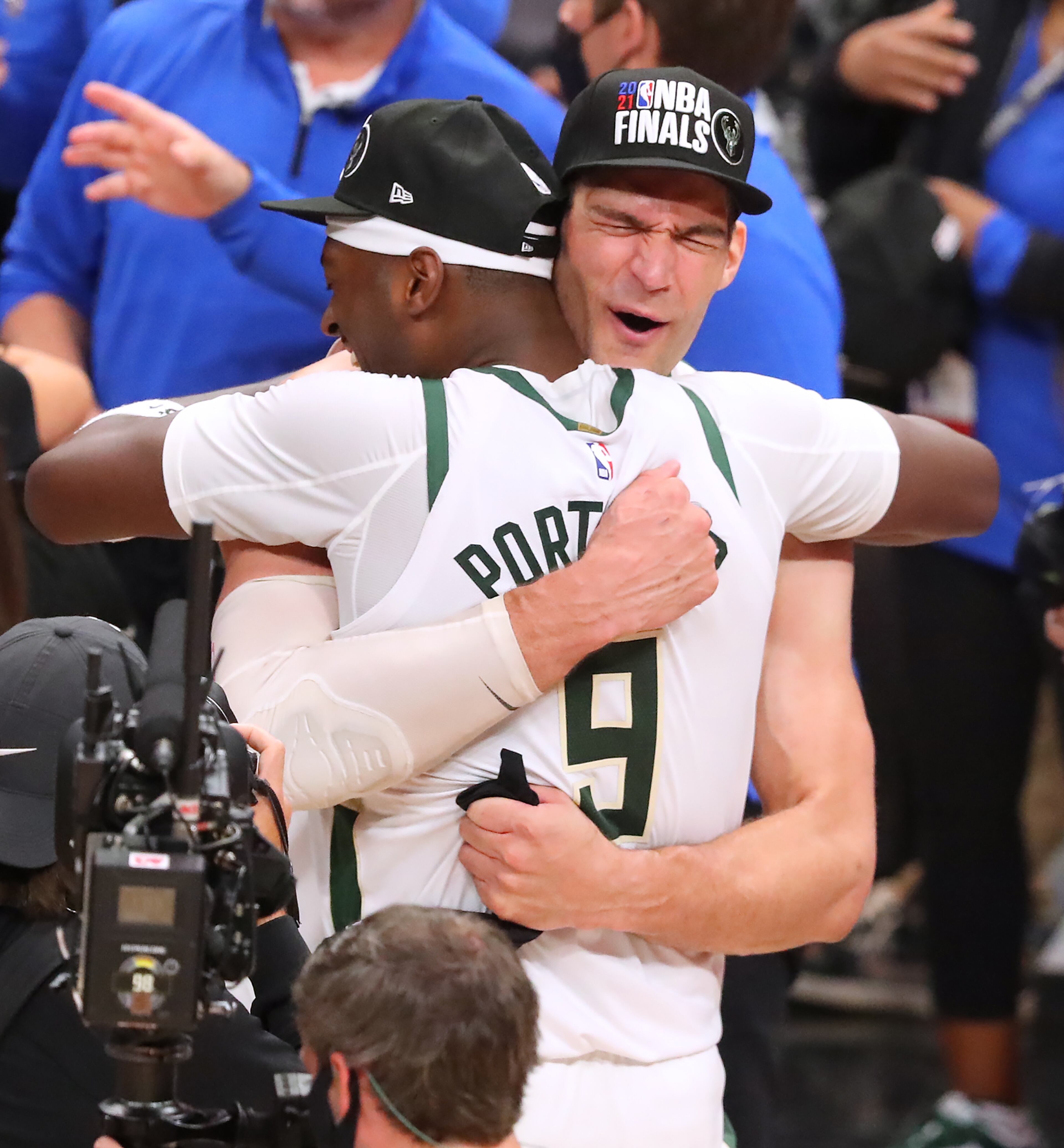 Milwaukee Bucks center Brook Lopez and forward Bobby Portis celebrate a 118-107 victory over the Atlanta Hawks in game 6 of the NBA Eastern Conference Finals on Saturday, July 3, 2021, in Atlanta. “Curtis Compton / Curtis.Compton@ajc.com”