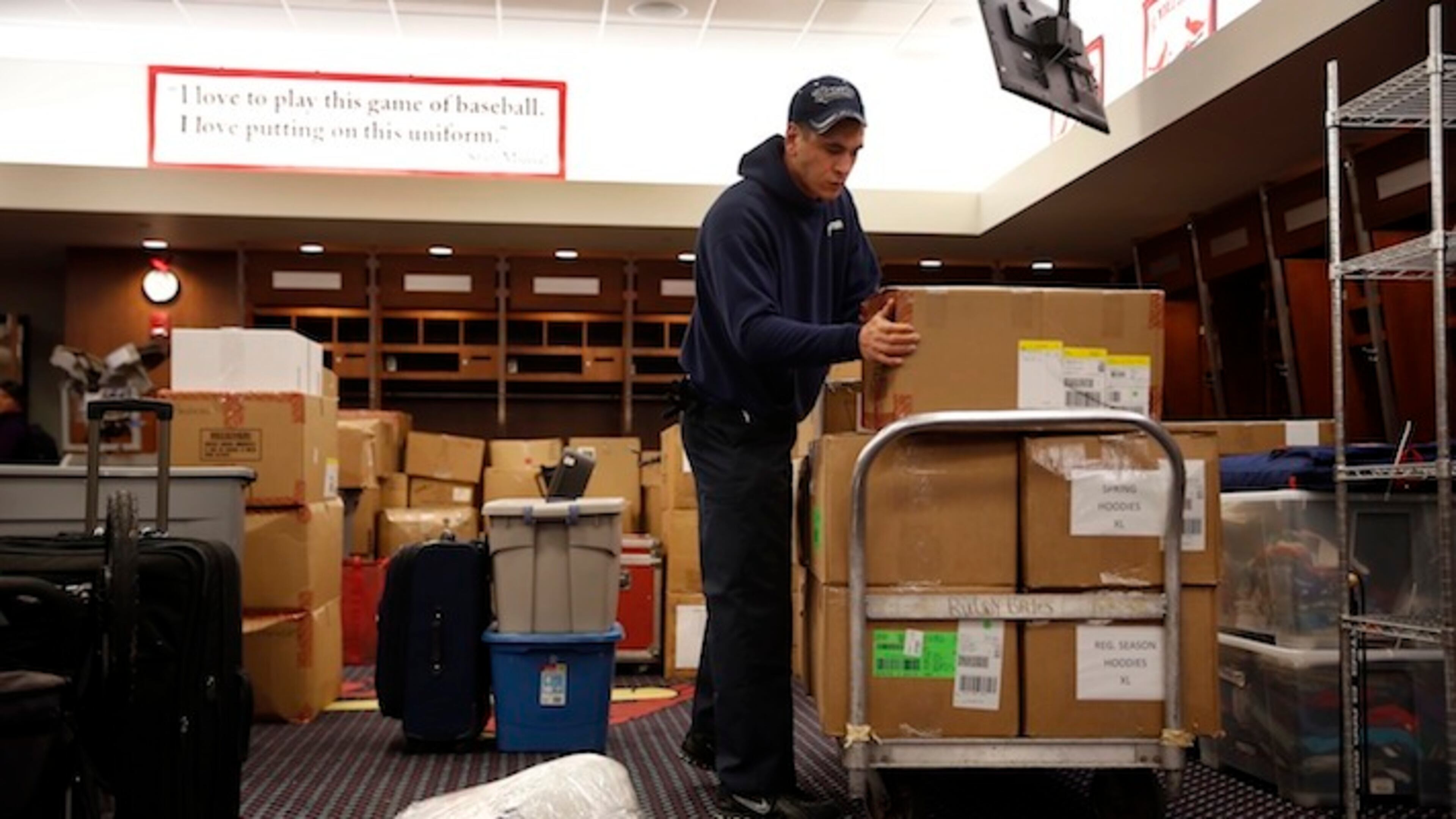 Dustin Heddy with United Van Lines packs up gear in the St. Louis Cardinals clubhouse to be sent to the baseball team's spring training facility Thursday, Feb. 11, 2016, in St. Louis. Cardinals pitchers and catchers are scheduled to report to camp on Feb. 17, 2016, in Jupiter, Fla. (AP Photo/Jeff Roberson)