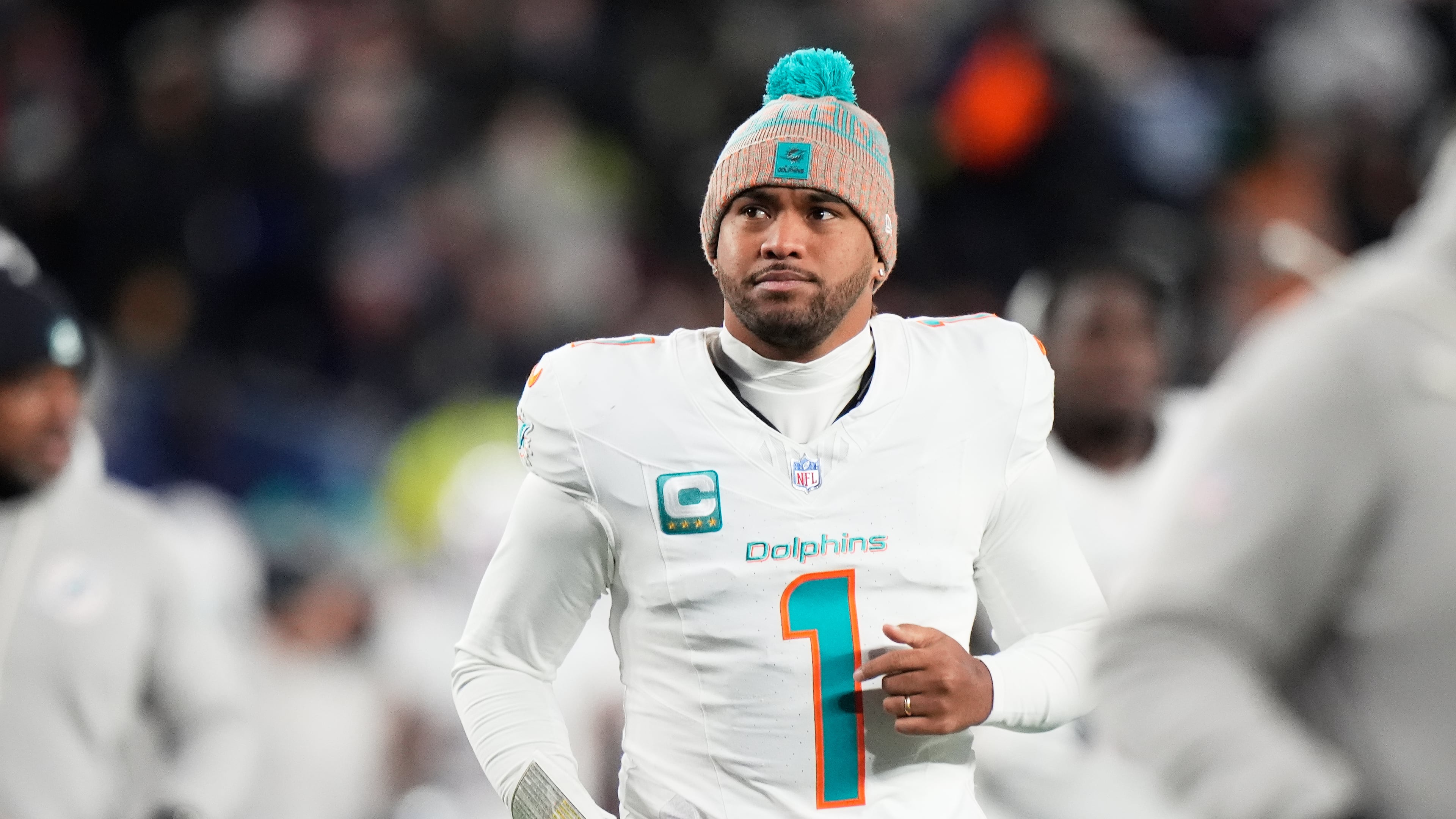 Miami Dolphins quarterback Tua Tagovailoa runs off the field during the first half of an NFL football game against the New England Patriots in Foxborough, Mass., Jan. 4, 2026. (Robert F. Bukaty/AP file)
