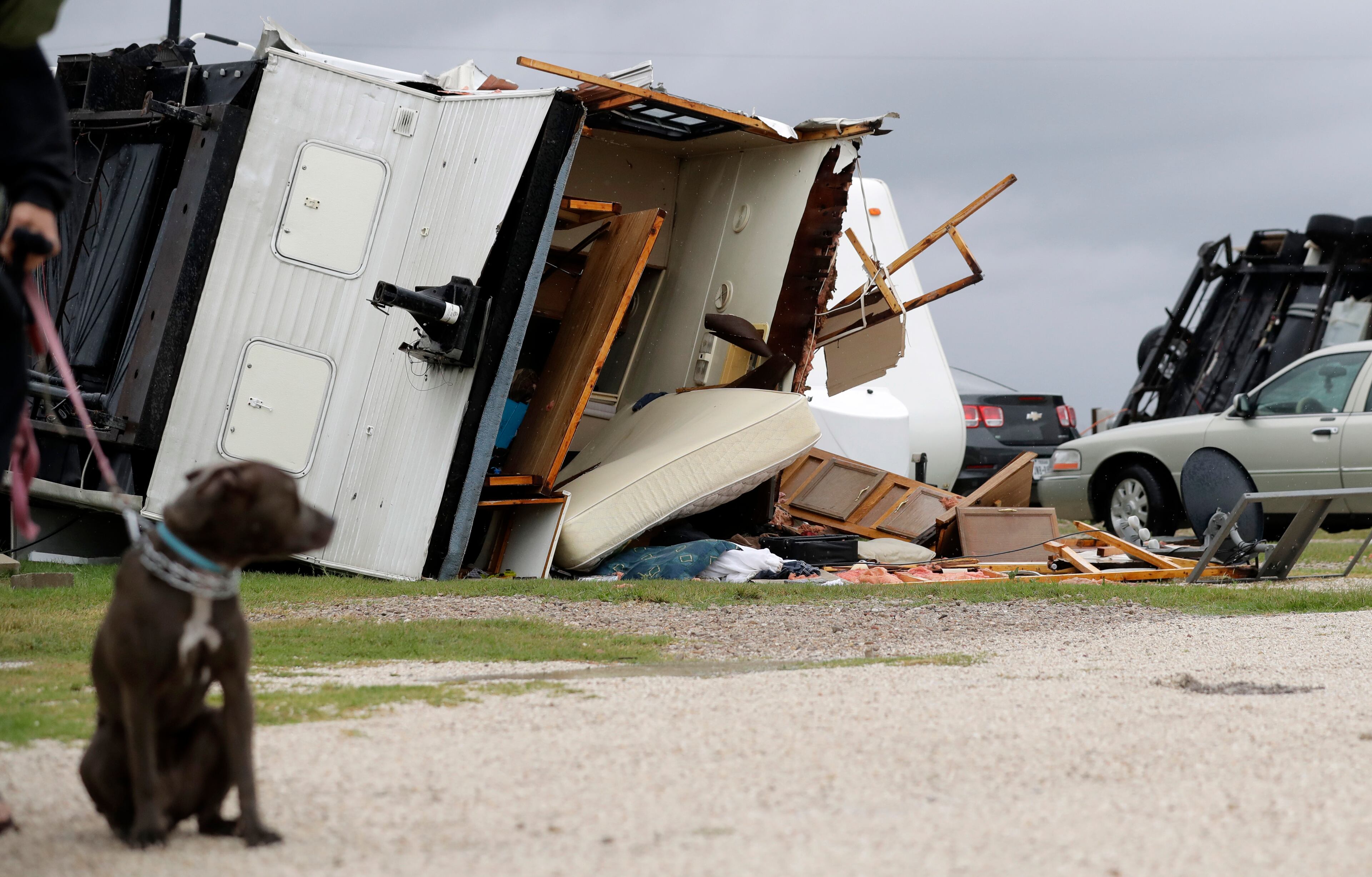 A trailer overturned in the wake of Hurricane Harvey lies on it's side, Saturday, Aug. 26, 2017, in Aransas Pass, Texas. Harvey rolled over the Texas Gulf Coast on Saturday, smashing homes and businesses and lashing the shore with wind and rain so intense that drivers were forced off the road because they could not see in front of them. (AP Photo/Eric Gay)