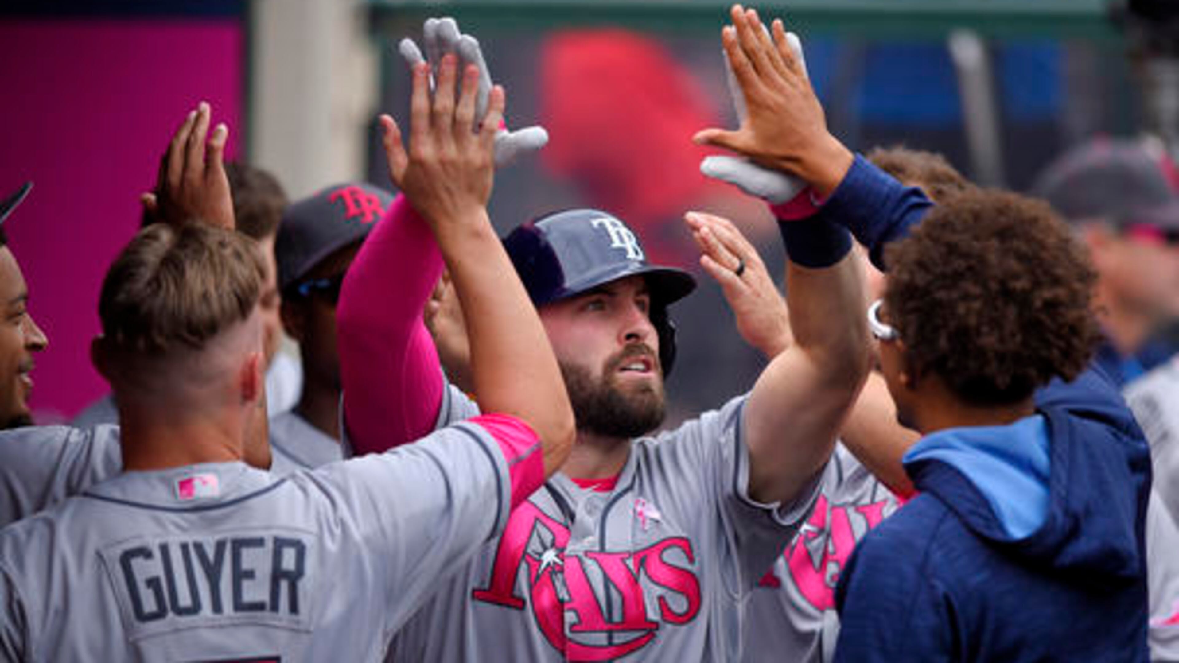 Tampa Bay Rays' Curt Casali, center, is congratulated by teammates after hitting a solo home run during the fifth inning of a baseball game against the Los Angeles Angels, Sunday, May 8, 2016, in Anaheim, Calif. (AP Photo/Mark J. Terrill)