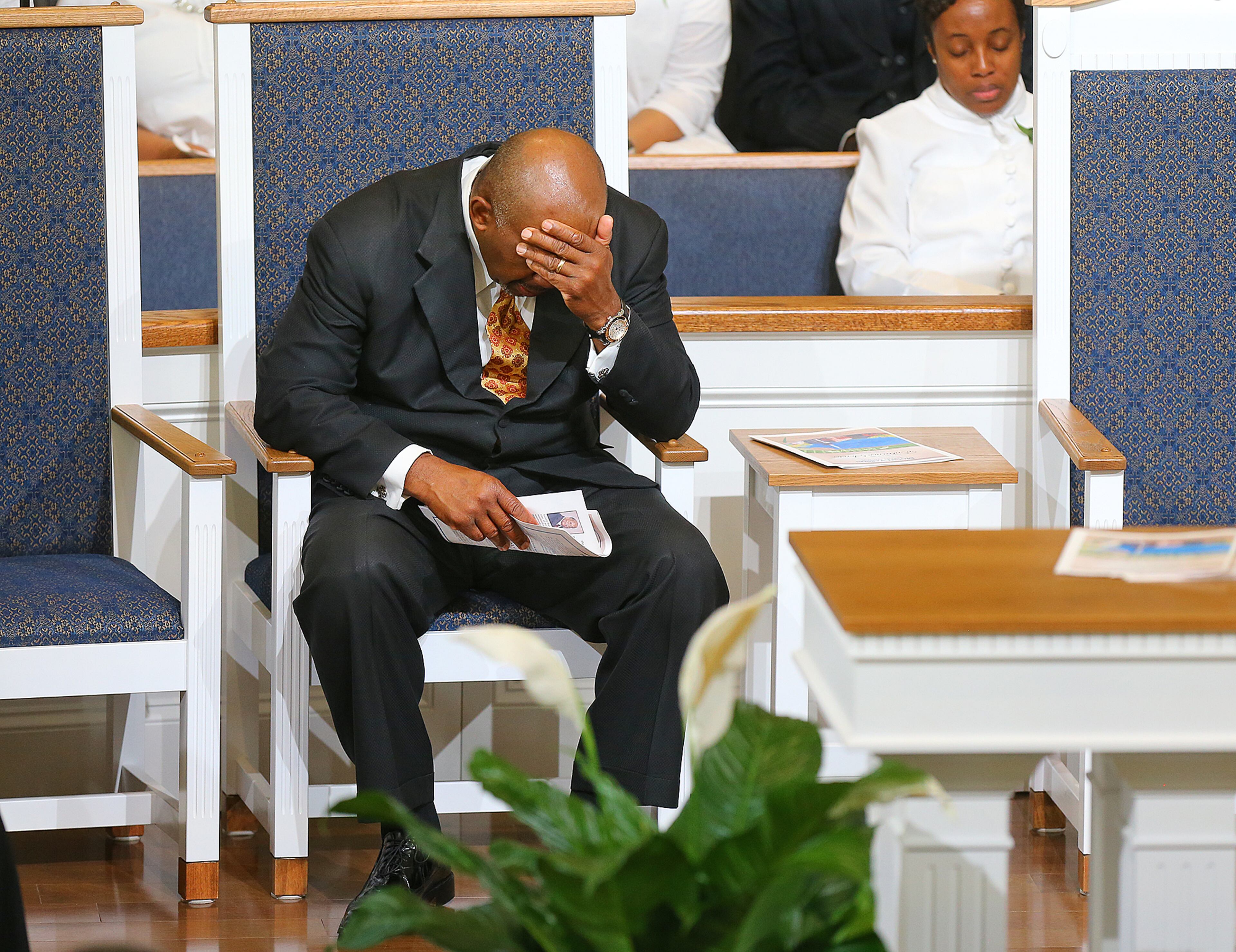 Reverend R. K. Turner, Pastor, bows his head in prayer during an emotional and joyous day for the Entrance Service in the new sanctuary at Mount Vernon Baptist Church on Palm Sunday, March 29, 2015, in Atlanta. The church moved locations to make way for the Falcons new stadium. Curtis Compton / ccompton@ajc.com