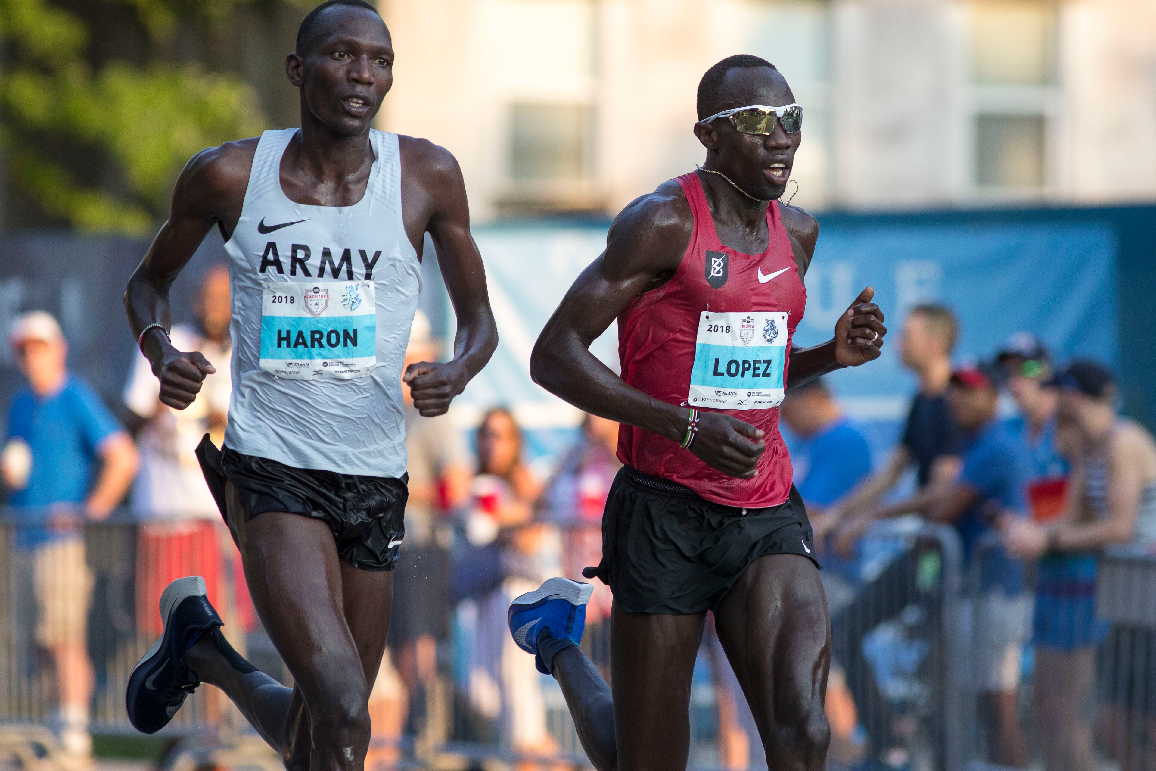 07/04/2018 -- Atlanta, GA -Front runners in the men's elite group push themselves during the 49th running of the AJC Peachtree road race near Piedmont Park, Wednesday, July 4, 2018. ALYSSA POINTER/ALYSSA.POINTER@AJC.COM