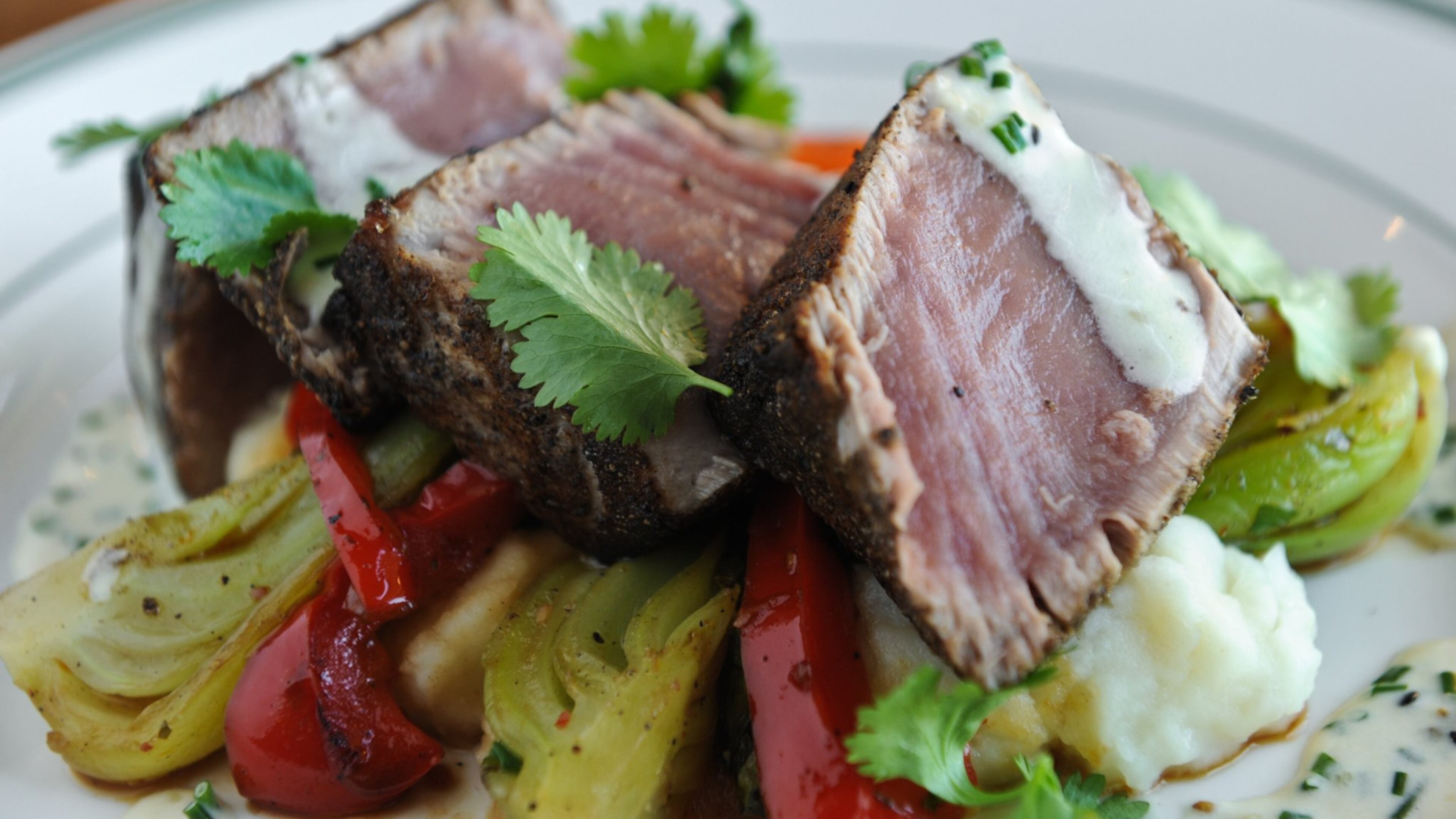 Seared rare ahi tuna, roasted butternut squash, portabello mushroom, ginger soy glaze, crispy onion straws. (BECKY STEIN)