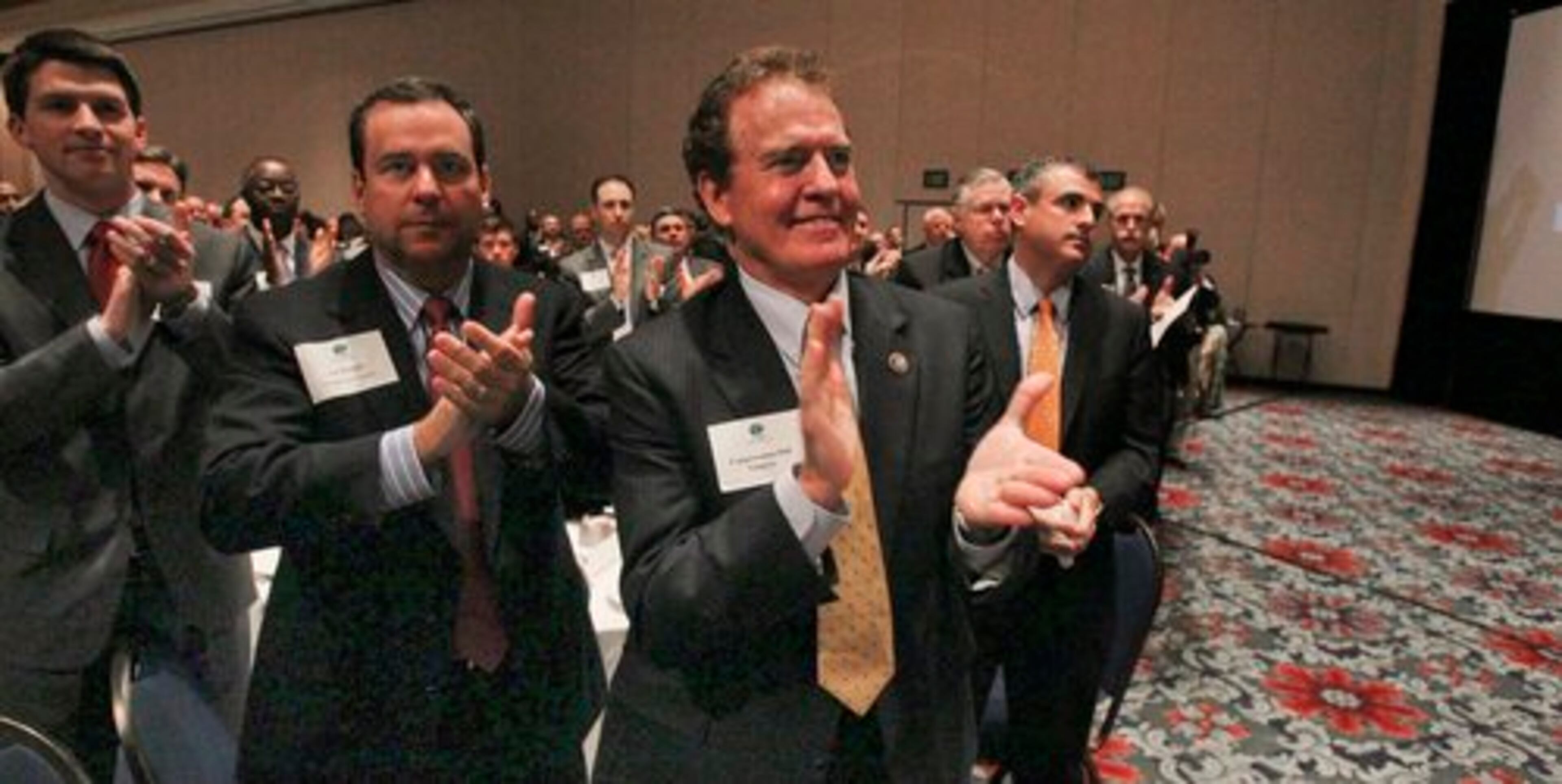 Tal Wright with Georgia Power Company (center- left) and Congressman Phil Gingrey (center-right) applaud as Governor Deal is announced as guest speaker.