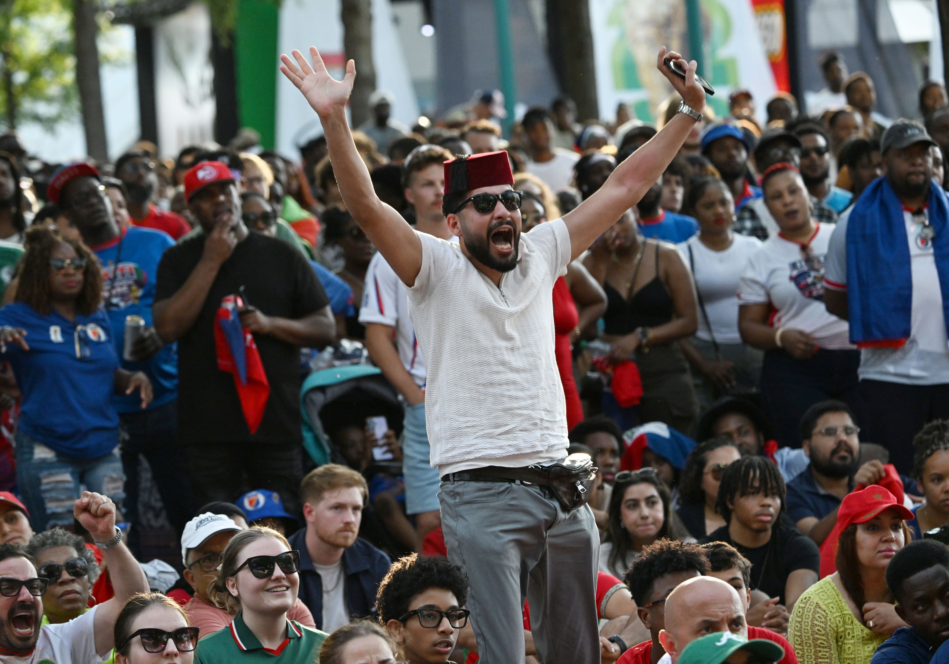 Morocco fans react to a goal as they gather to watch the match between Morocco vs. Haiti at the FIFA Fan Festival in Centennial Olympic Park on Wednesday, June 24, 2026, in Atlanta. (Hyosub Shin/AJC)