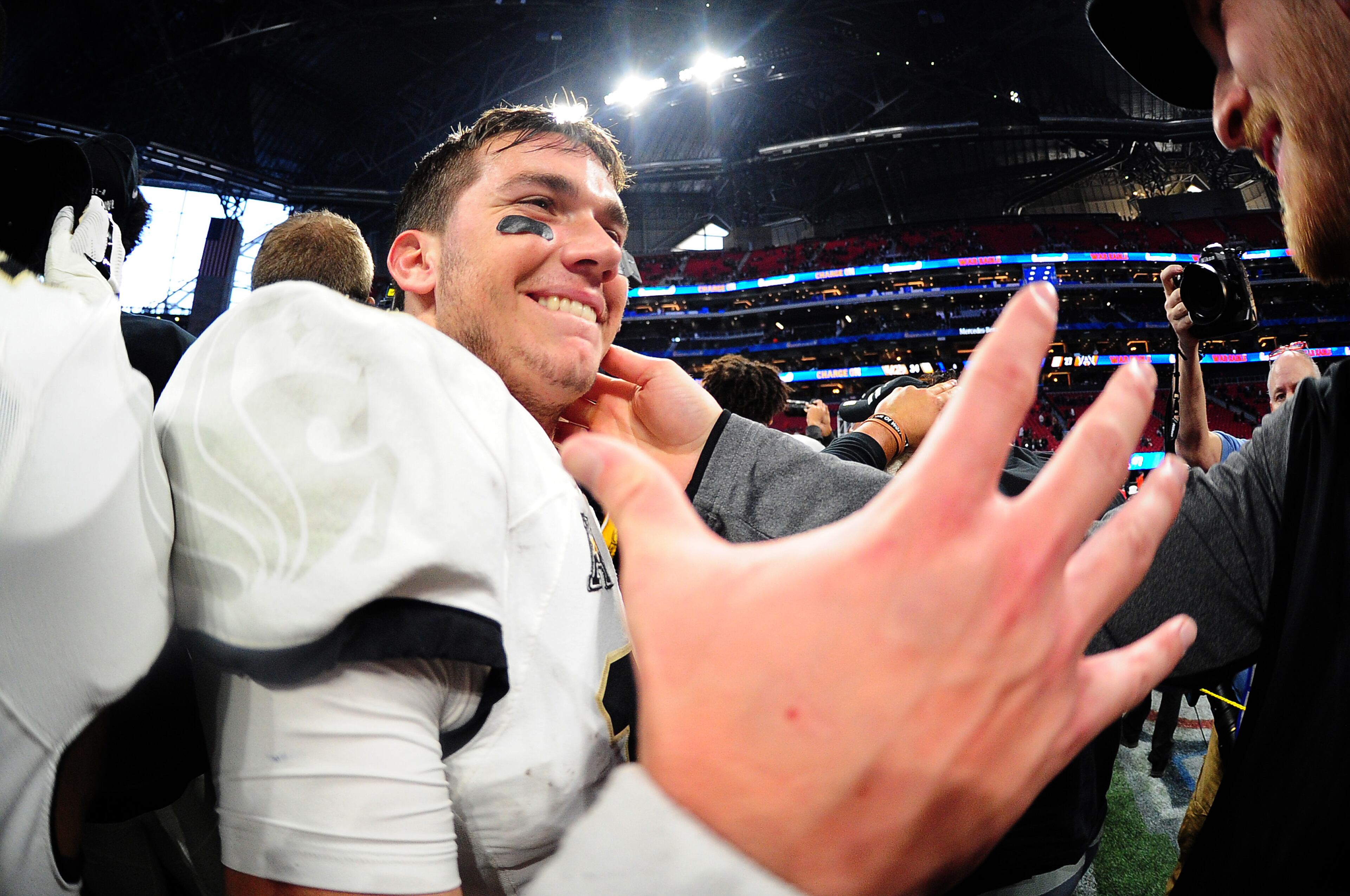 ATLANTA, GA - JANUARY 1: McKenzie Milton #10 of the Central Florida Knights celebrates after the game against the Auburn Tigers during the Chick-fil-A Peach Bowl on January 1, 2018 in Atlanta, Georgia. (Photo by Scott Cunningham/Getty Images)