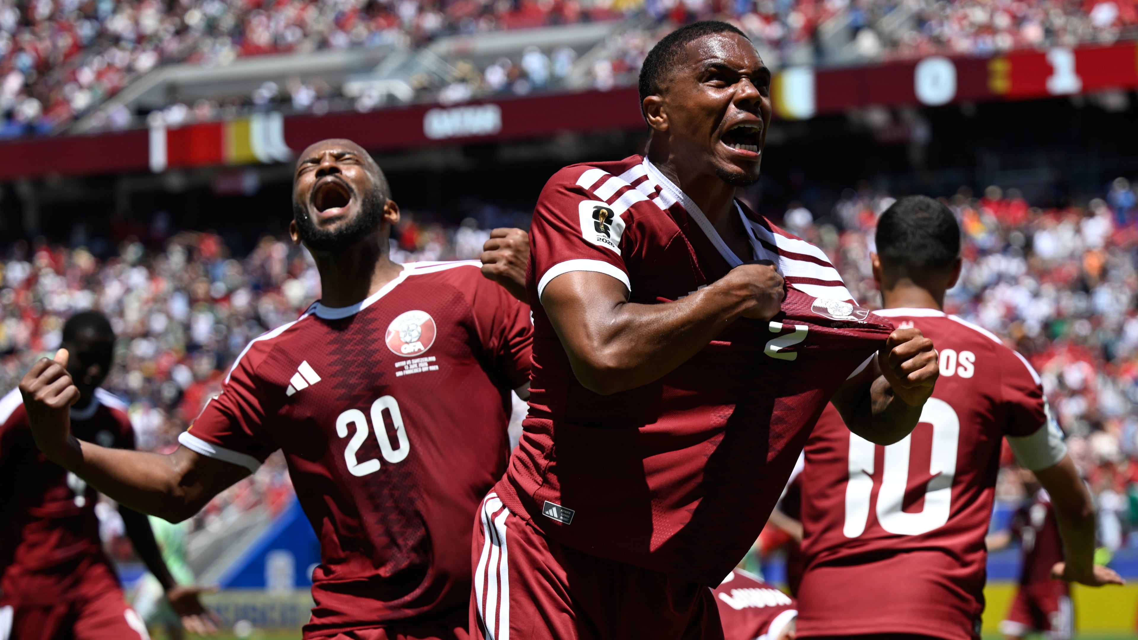 Qatar's Pedro Miguel, yells as he celebrates after teammate Qatar's Boualem Khoukhi, scored his sides first goal during the World Cup Group B soccer match between Qatar and Switzerland in Santa Clara, Calif., near San Francisco, Saturday, June 13, 2026. (AP Photo/Eakin Howard)