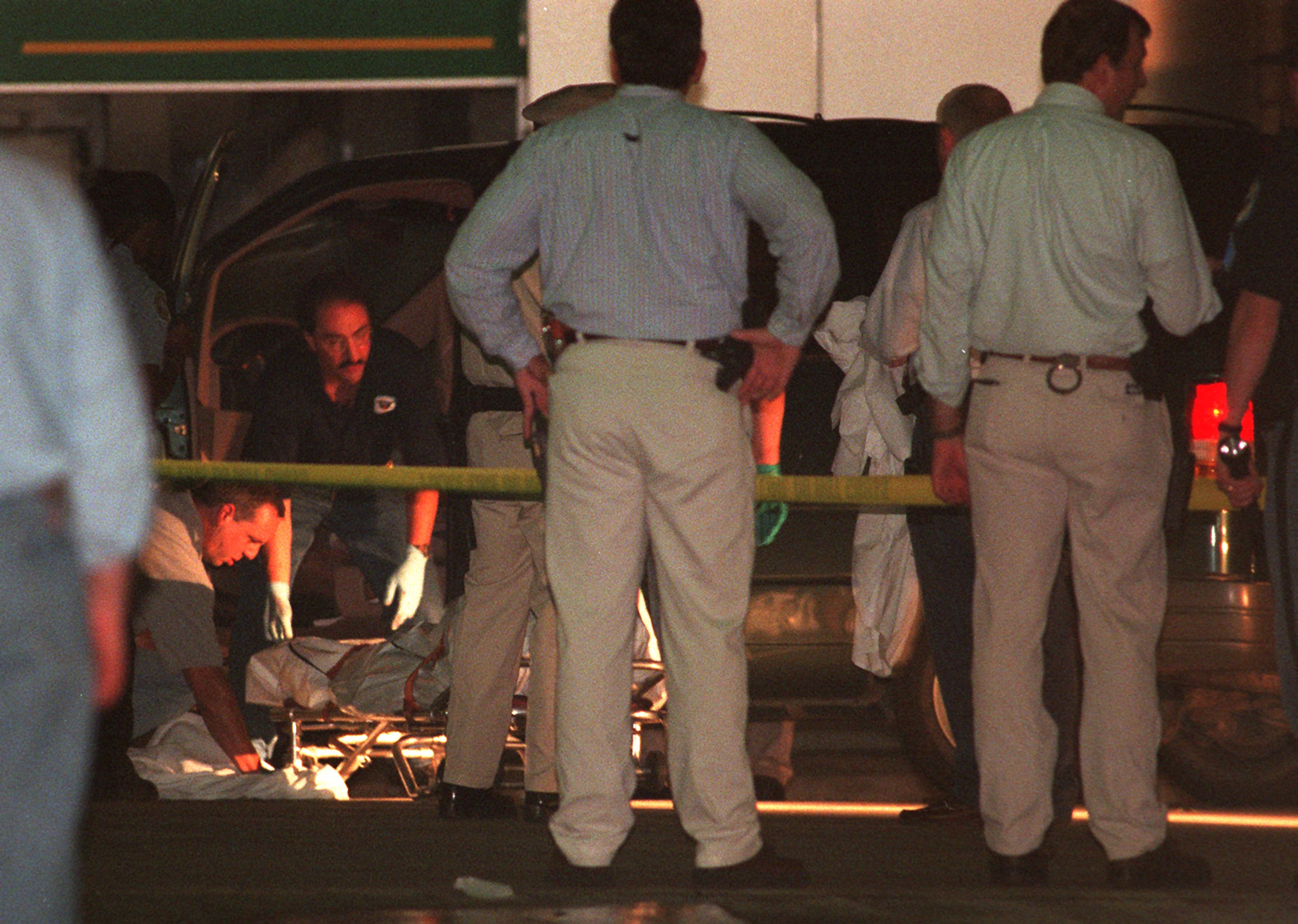 Officials remove Mark Barton's body from his van after he shot and killed himself at an Austell gas station on Highway 92 near I-75 the same evening after his shooting spree in Buckhead.