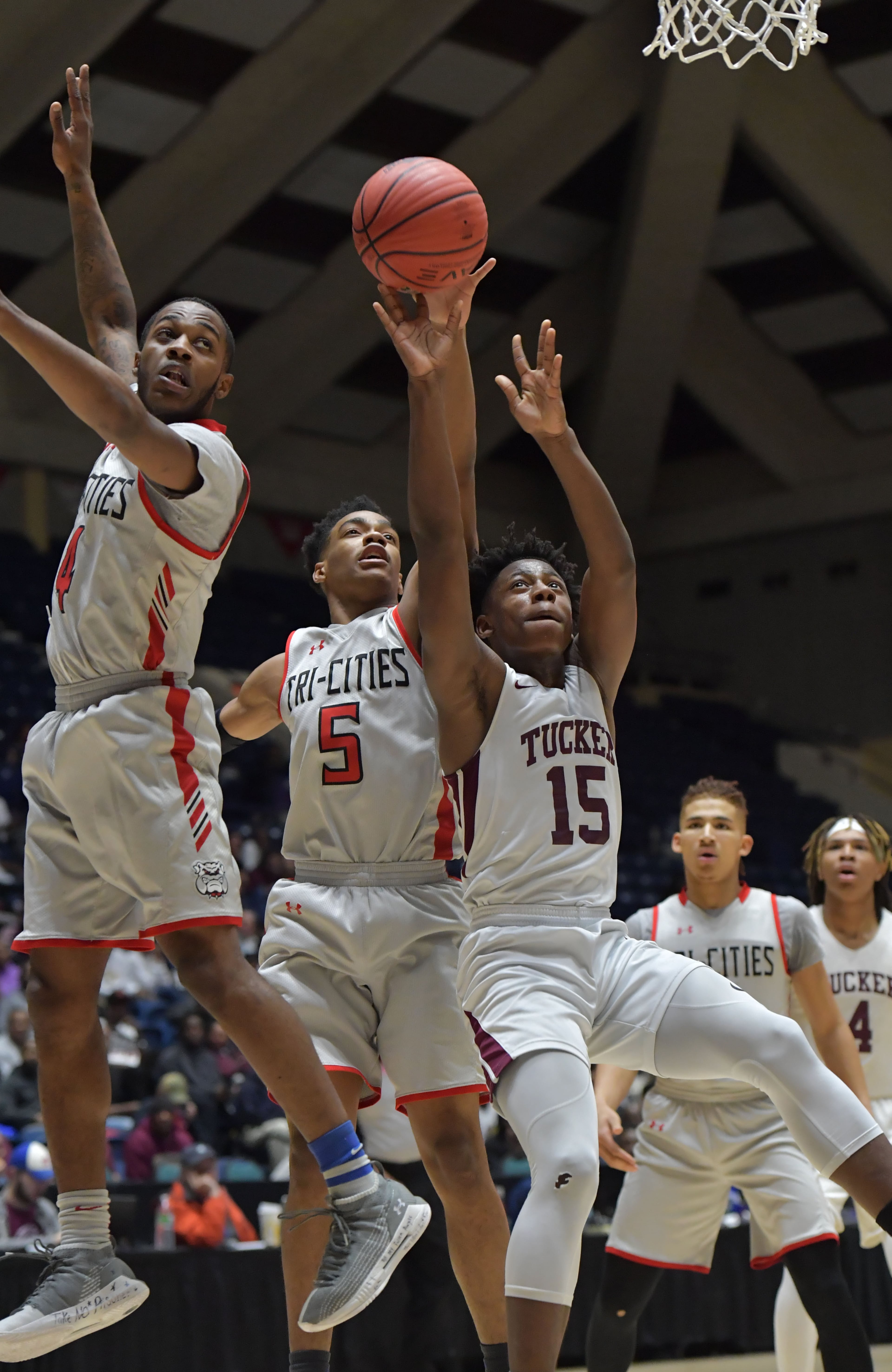 March 9, 2019 Macon - Tri-Cities Da'Marcus Johnson (5) shoots over Tucker Raylan Barrion (15) in GHSA State Basketball Championship game at the Macon Centreplex in Macon on Saturday, March 9, 2019. Tri-Cities won 46-43 over the Tucker. HYOSUB SHIN / HSHIN@AJC.COM