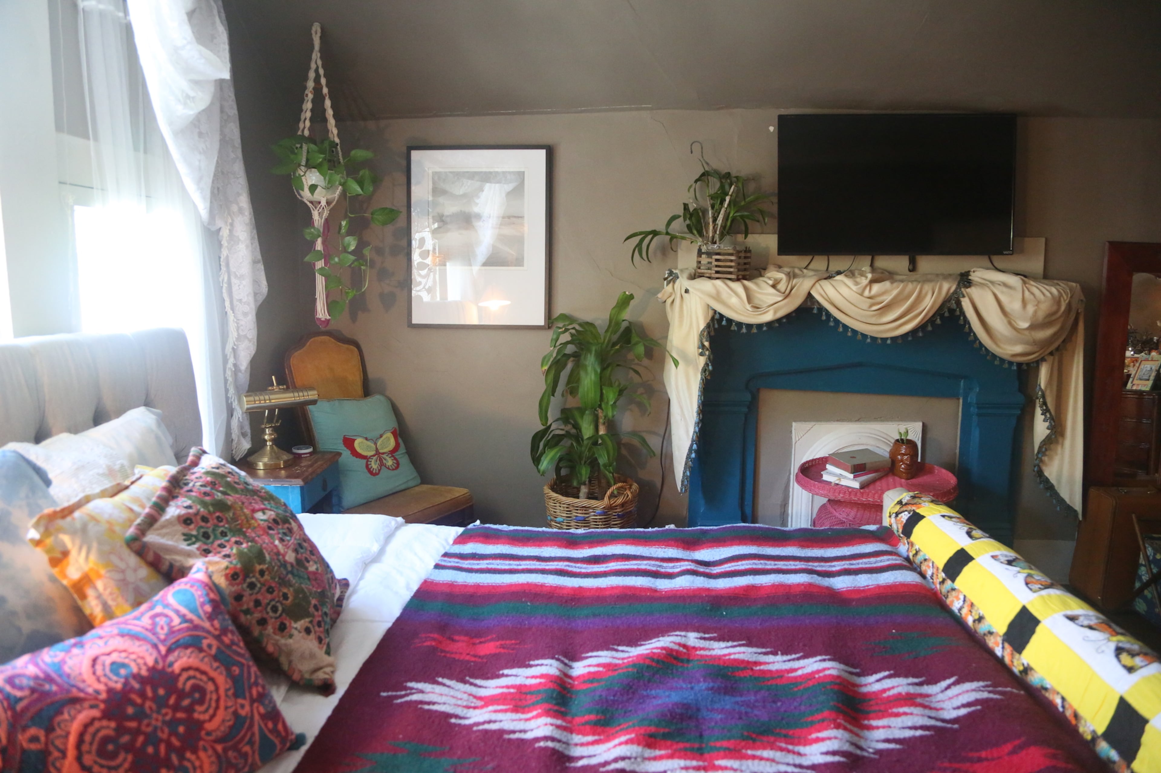 Moroccan prints and vintage rugs and throws are common elements in the home's bohemian and eclectic style.