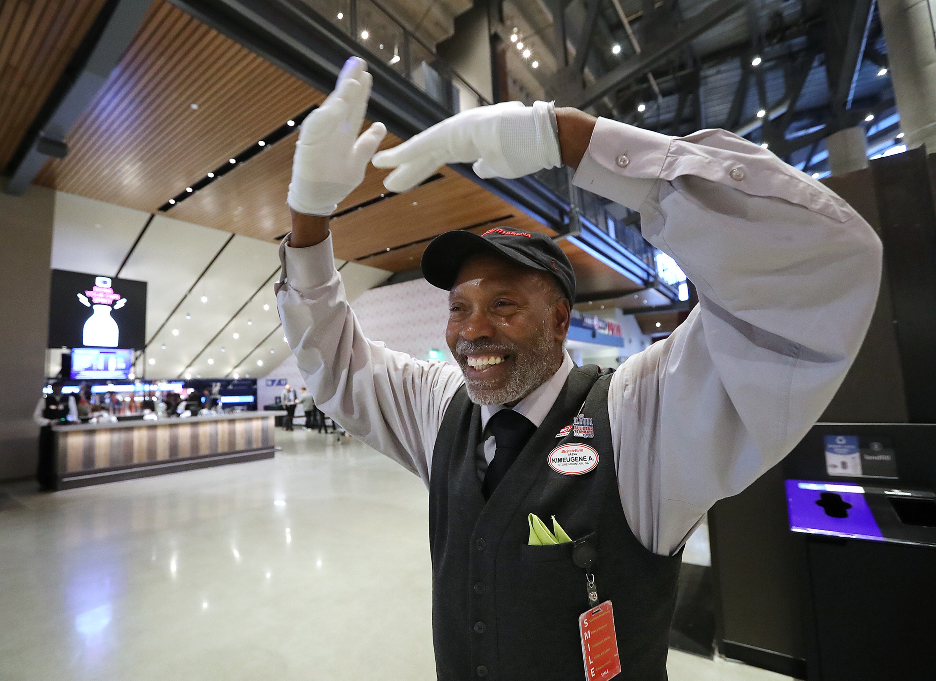 Hawks usher Kim Armstrong, the smile maker, welcomes fans arriving to watch the team play the New York Knicks in a NBA basketball game on Wednesday, March 11, 2020, in Atlanta. As the country grapples with coronavirus and how to best combat the spread of the disease, athletic teams and organizations are asking themselves that same question. Curtis Compton ccompton@ajc.com