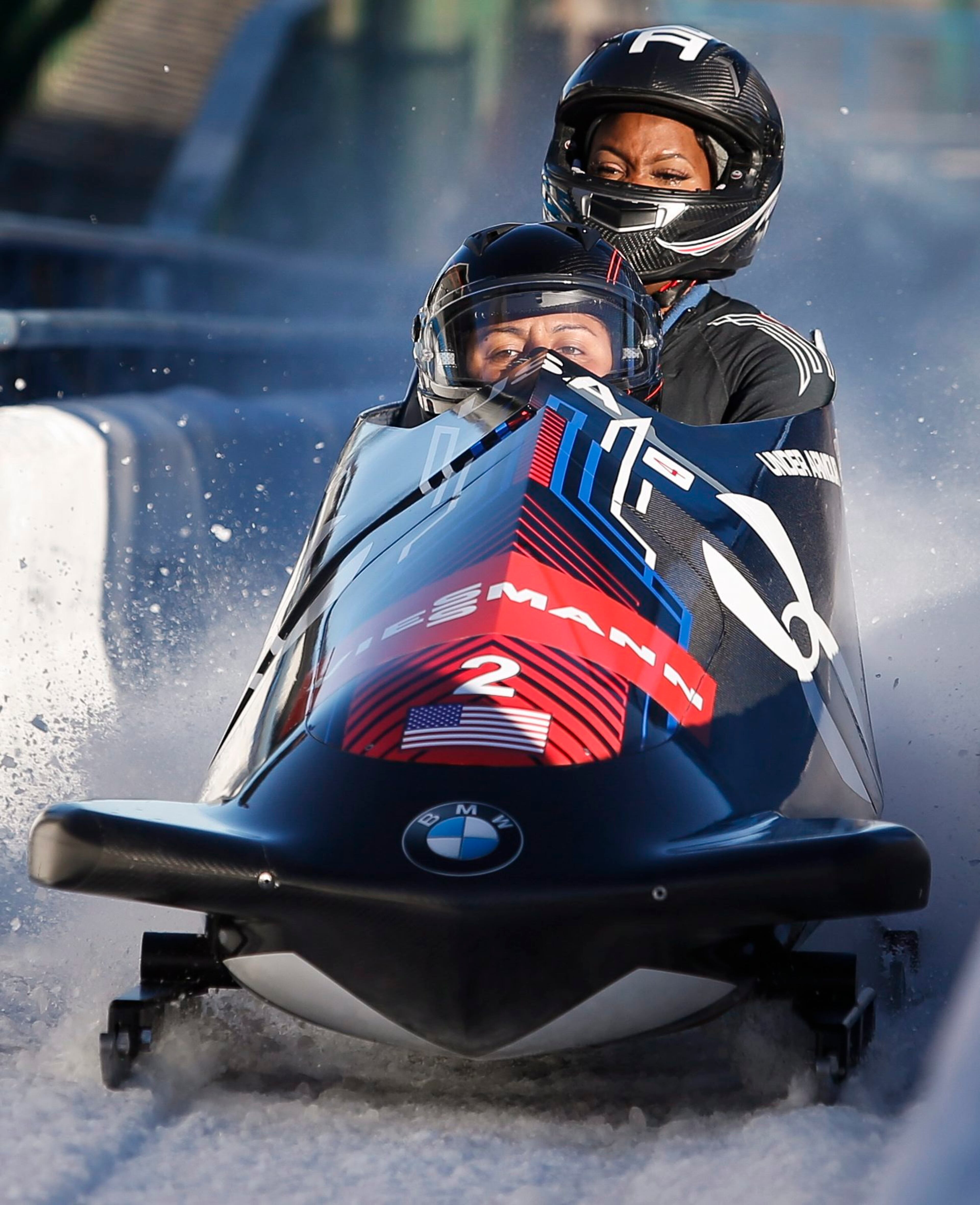 Elana Meyers Taylor and Cherrelle Garrett, of the United States, finish in first place at the women's World Cup bobsled event in Calgary, Alberta, Canada on Saturday, Dec. 20, 2014. (AP Photo/The Canadian Press, Jeff McIntosh)