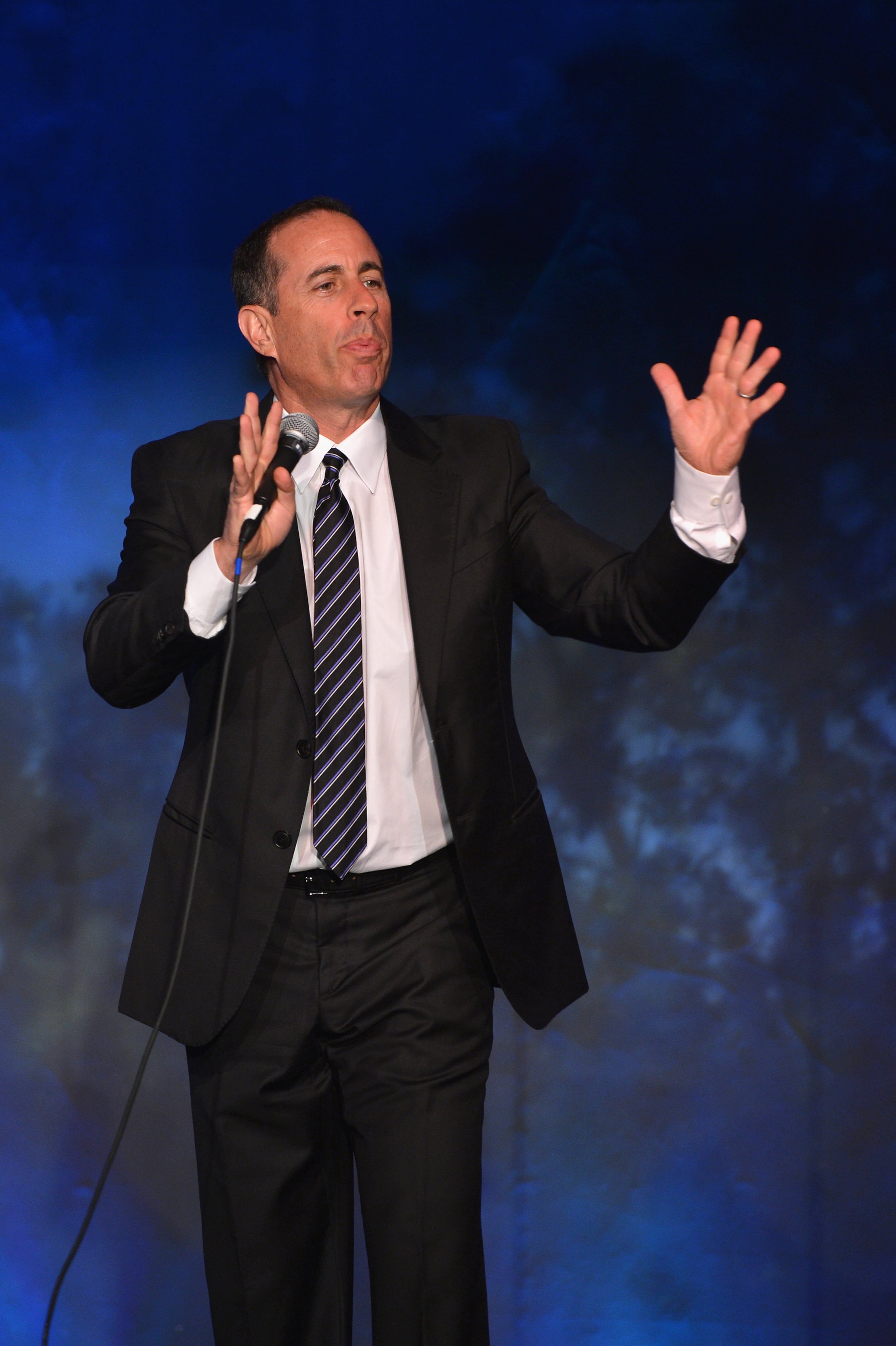 Comedian Jerry Seinfeld preforms during SeriousFun Children's Network event honoring Liz Robbins with celebrity guests at Pier Sixty at Chelsea Piers on April 4, 2013 in New York City. (Photo by Larry Busacca/Getty Images for SeriousFun Children's Network)