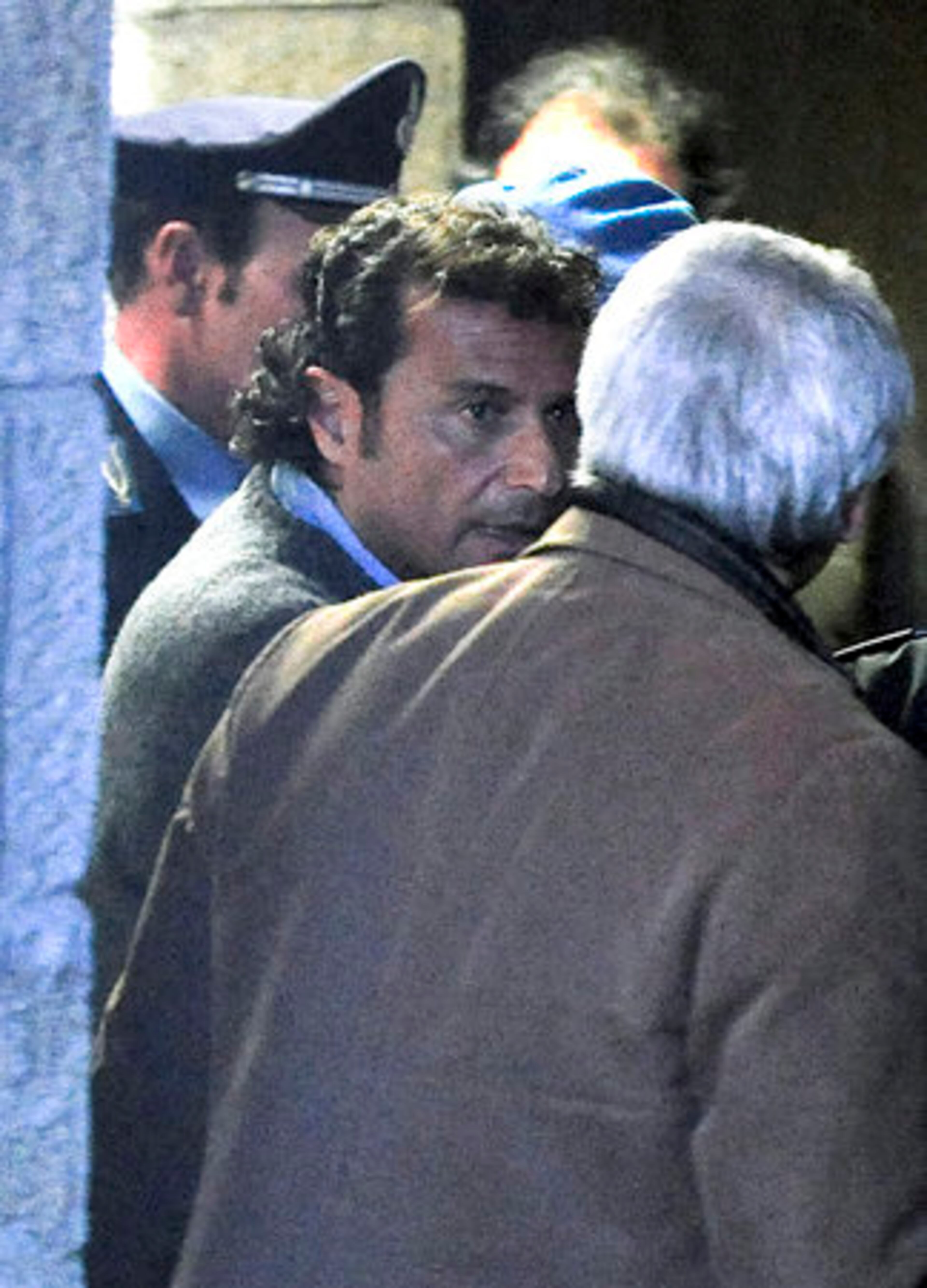 Francesco Schettino, center, the captain of the luxury cruiser is being investigated for manslaughter charges and abandoning the ship.