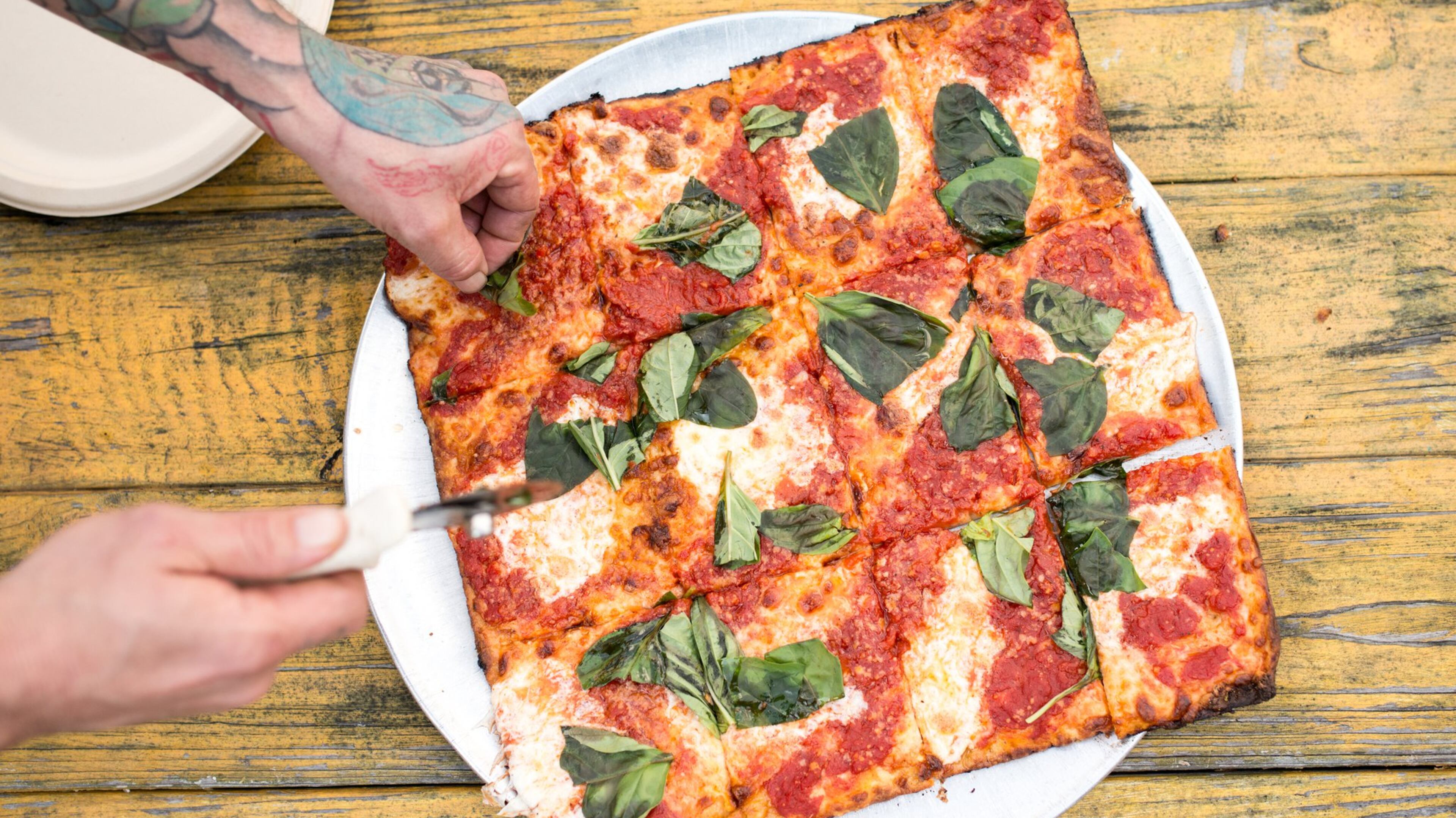 The Grandma Pie is a chewy, crispy, saucy, cheesy study in delicious simplicity. Photo Credit- Mia Yakel. Styling Credit- Anthony Spina.