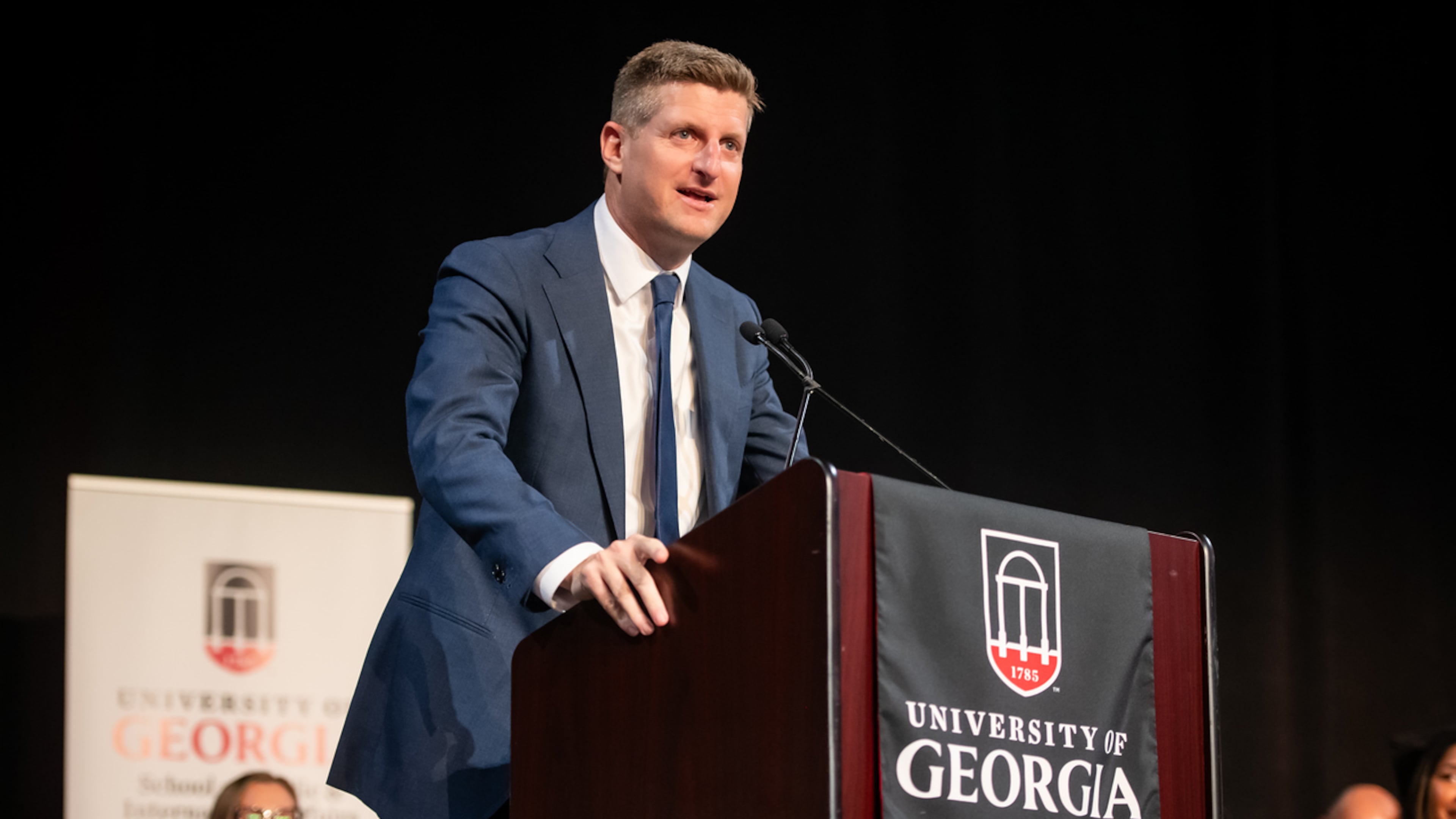 AJC chief political reporter Greg Bluestein delivers the convocation address at the University of Georgia's School of Public and International Affairs on May 8, 2026. (Justin Evans for the AJC)