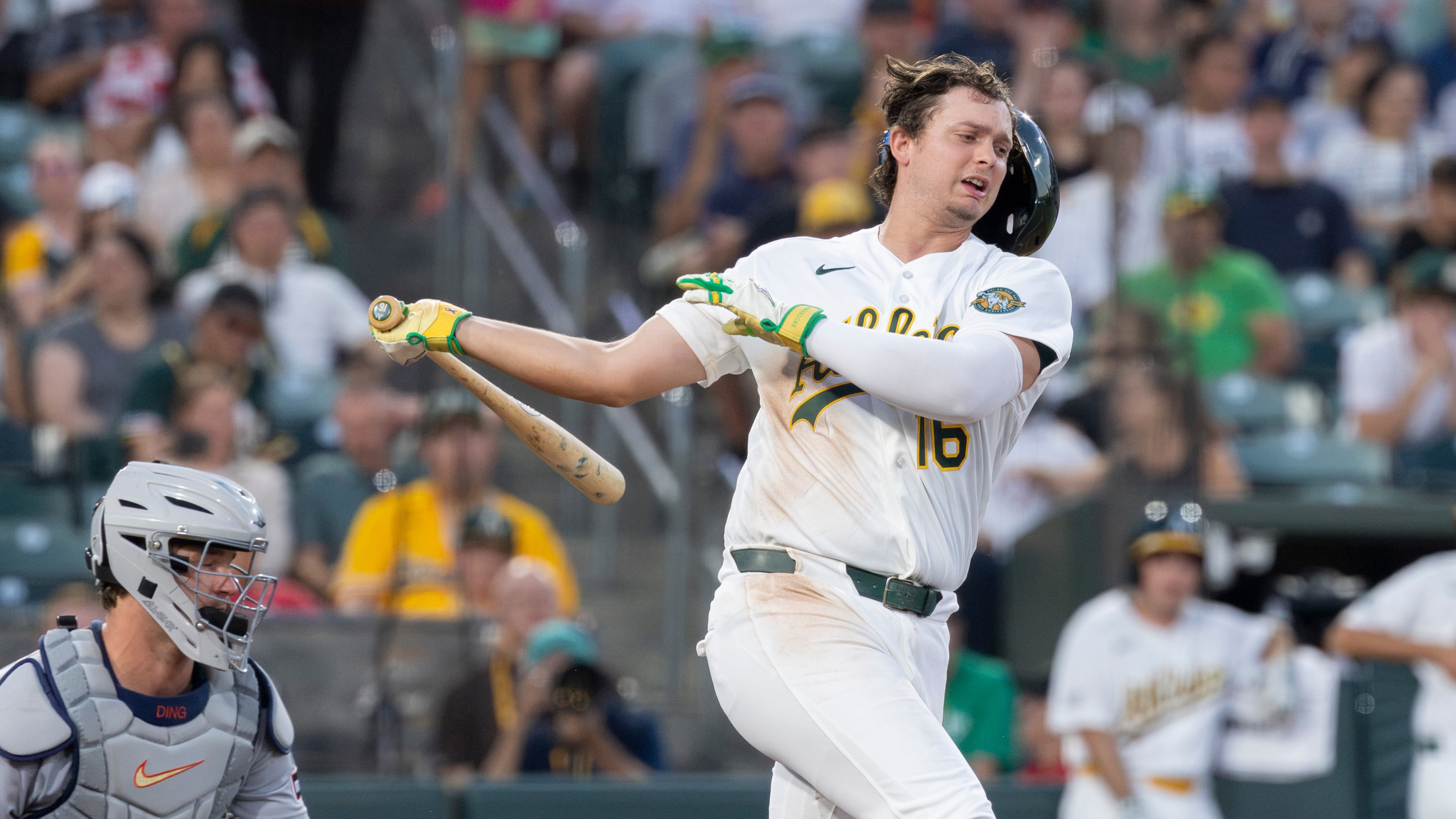 Athletics' Nick Kurtz loses his batting helmet on a swing during the fifth inning of a baseball game against the Detroit Tigers, Friday, July 31, 2026, in West Sacramento, Calif. (AP Photo/Sara Nevis)