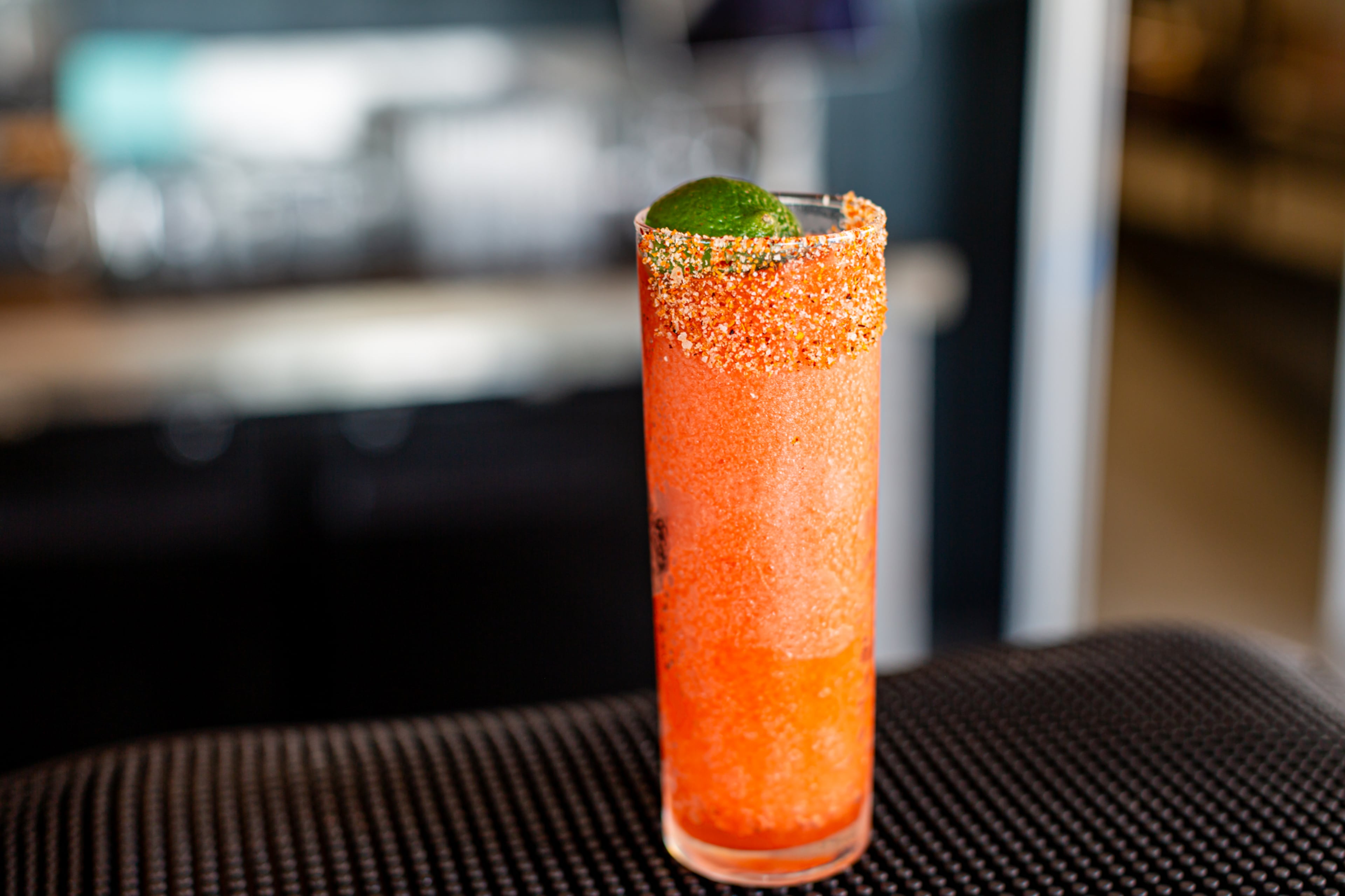 The sweet, tart and slushy pink Cadillac at Westside Motor Lounge. Note the Tajin rim, made from a combo of mild chili peppers, lime and sea salt. (Courtesy of Westside Motor Lounge)
