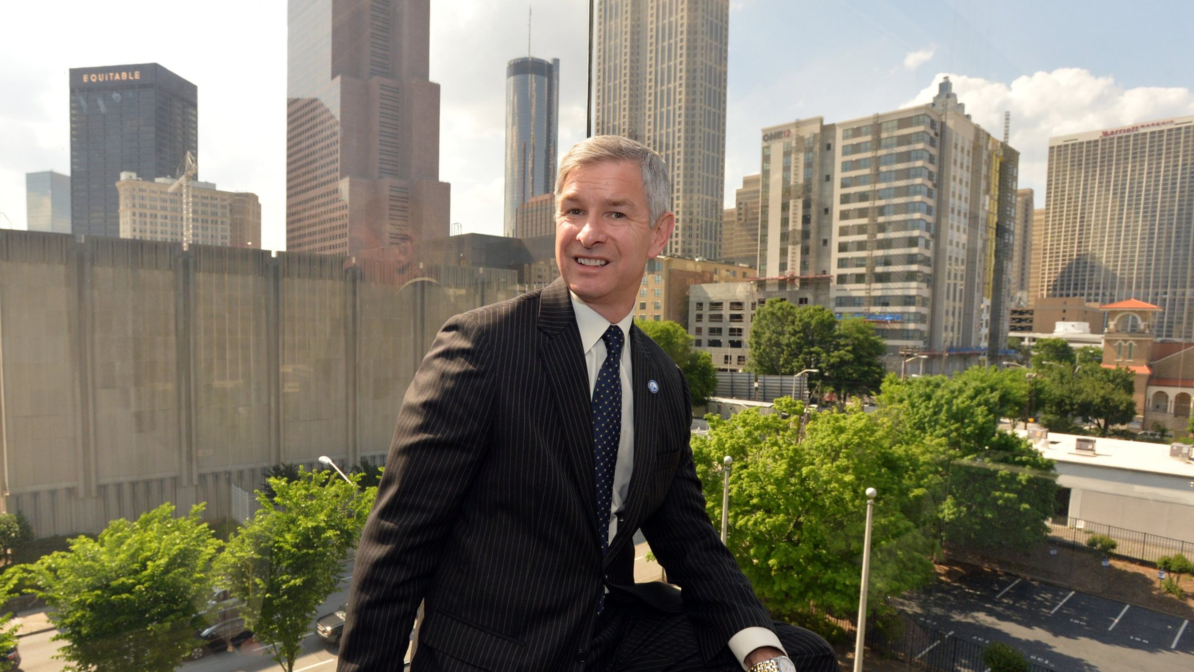 May 13, 2014 Atlanta - Portrait of Georgia State University President Mark Becker at his office on Tuesday, May 13, 2014. Within the past 16 years, Georgia State University has completed projects equal to more than half the size of the Mall of Georgia, not including student housing and sports fields, turning a commuter school into a residential campus. Now president Mark Becker and a development team want to convert 77 acres of Turner Field and its parking lots into a $300 million project that will extend the university’s reach. HYOSUB SHIN / HSHIN@AJC.COM