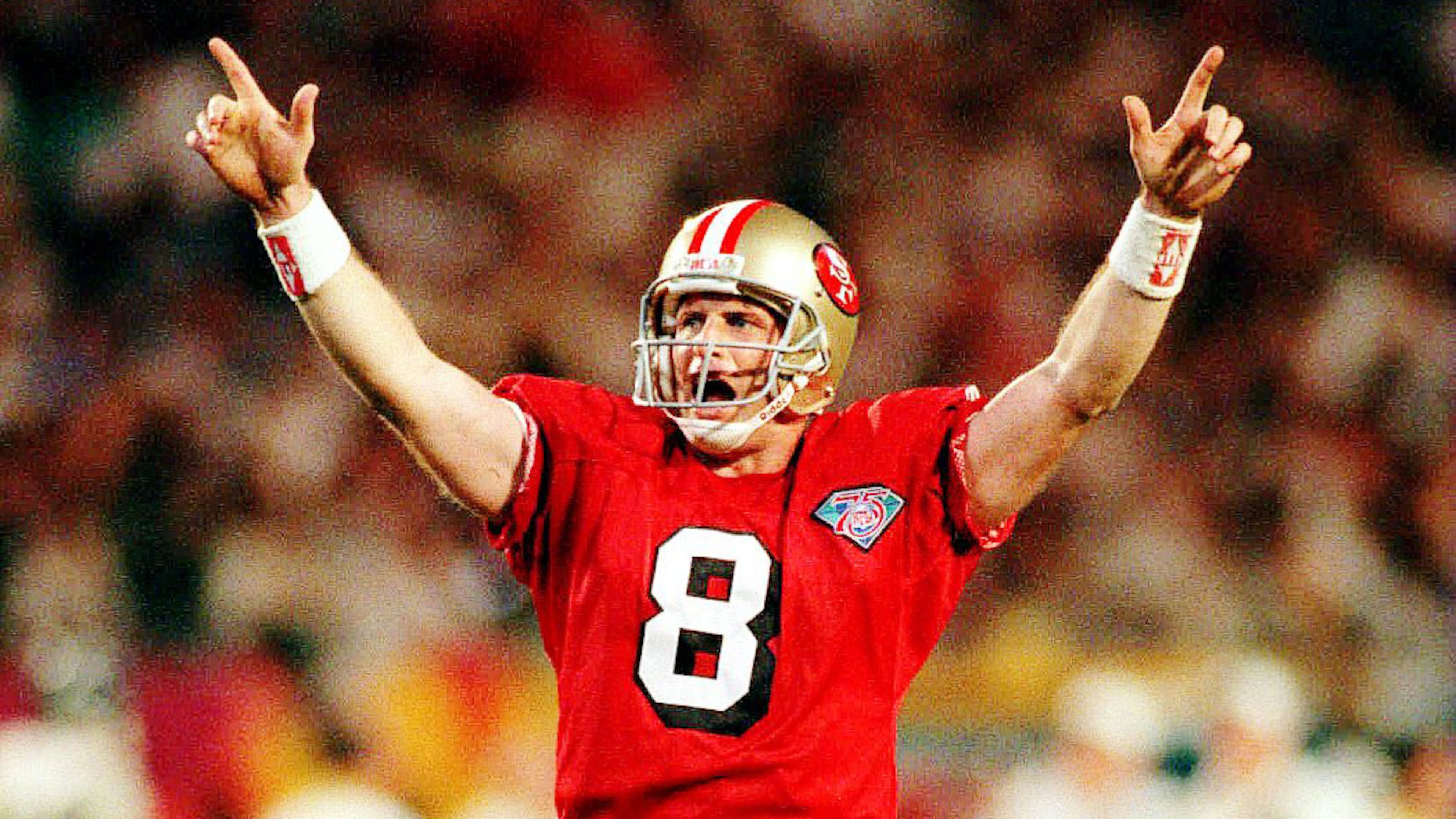 29 JAN 1995 SAN FRANCISCO QUARTERBACK STEVE YOUNG CELEBRATES AFTER THROWING A 15 YARD TOUCHDOWN PASS TO JERRY RICE TO PUT THE 49ERS UP 42 10 DURING THE THIRD QUARTER OF THE SAN FRANCISCO 49ERS VERSUS SAN DIEGO CHARGERS IN SUPER BOWL XXIX AT JOE ROBBIE STADIUM IN MIAMI FLORIDA YOUNG WHO WAS NAMED THE SUPERBOWL MOST VALUABLE PLAYER SET A SUPER BOWL RECORD FOR MOST TOUCHDOWNS IN A GAME WITH SIX BREAKING JOE MONTANA'S PREVIOUS RECORD OF FIVE Mandatory Credit Mike Powell ALLSPORT