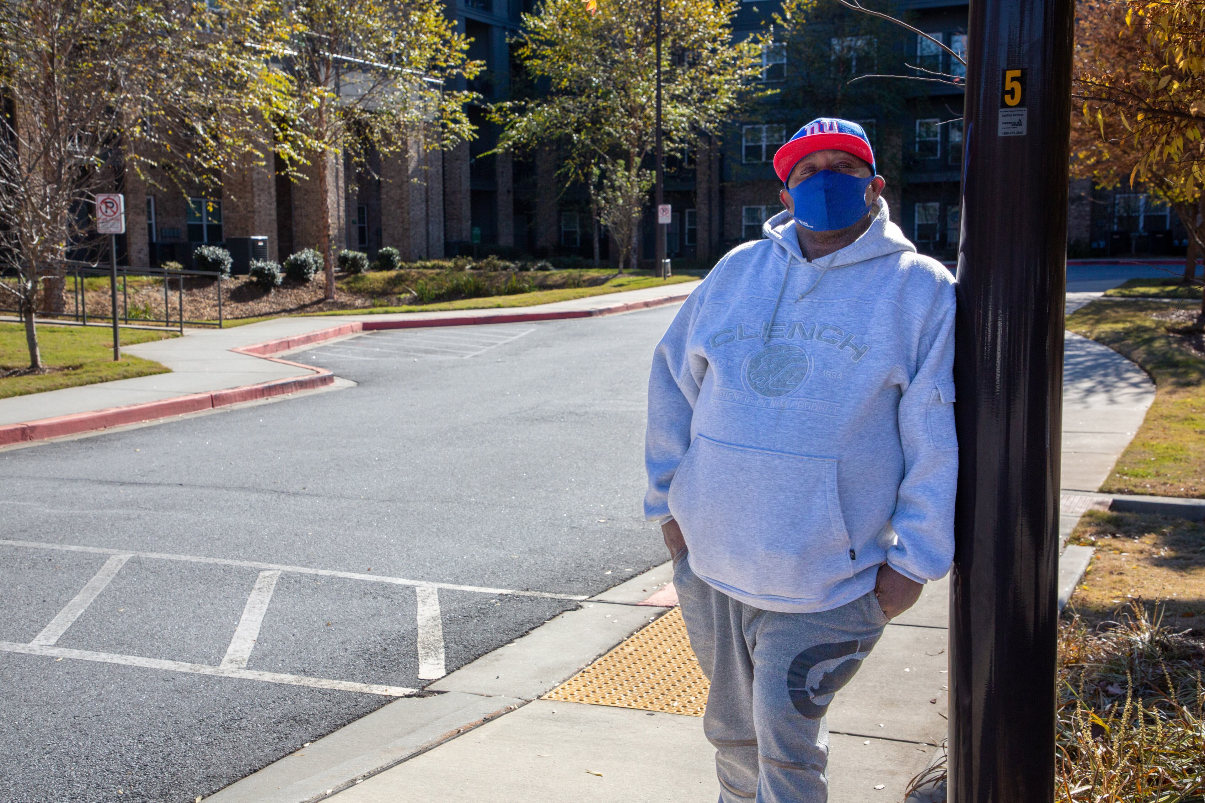 Resident Kenneth Walker stands outside the Manor at Indian Creek apartments in Stone Mountain Mondy, November 29, 2021. STEVE SCHAEFER FOR THE ATLANTA JOURNAL-CONSTITUTION