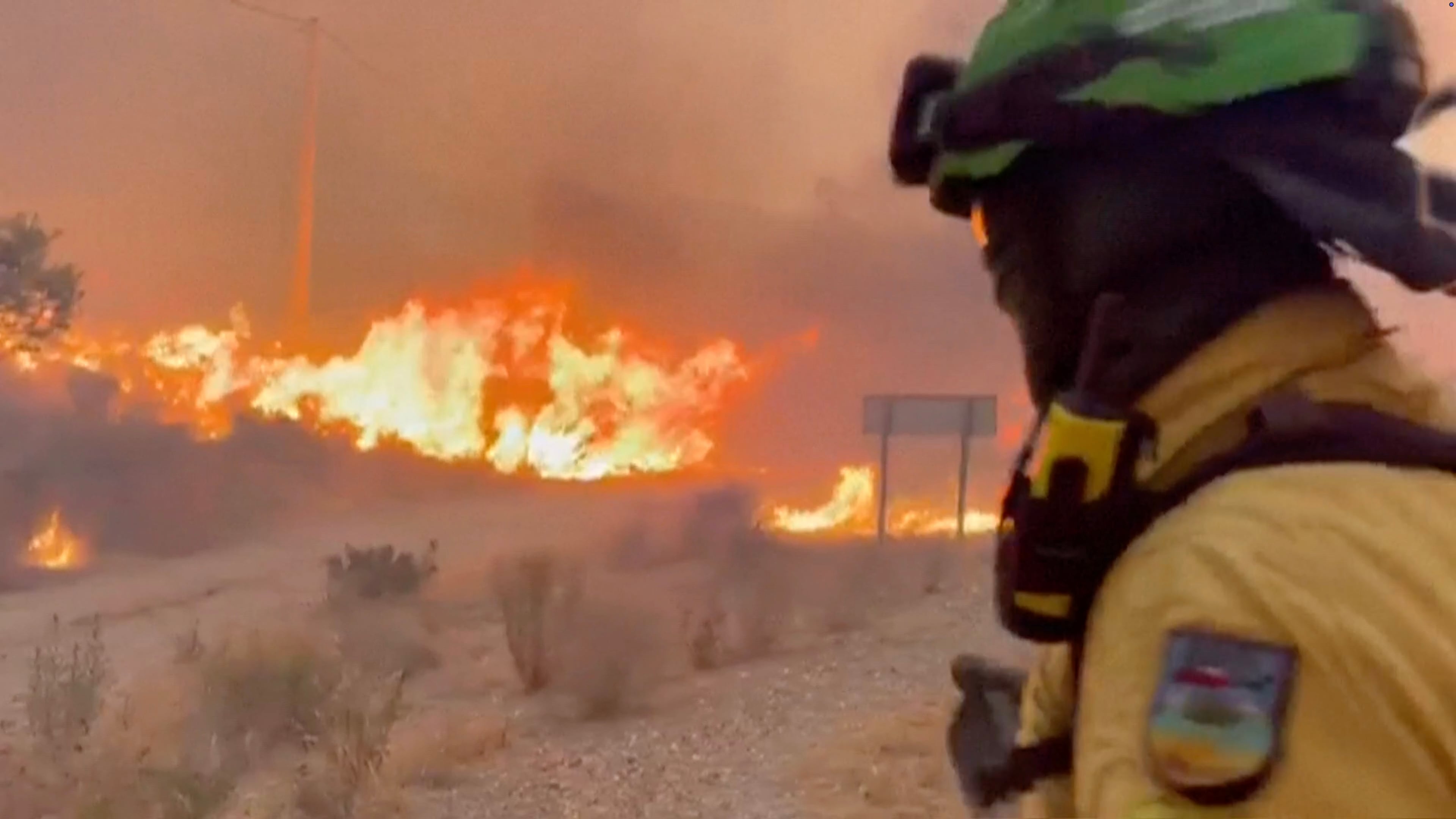 This image made from video provided by INFOCA shows firefighters battling a wildfire near Los Gallardos, Almeria, Spain, on Thursday, July 9, 2026. (INFOCA via AP)