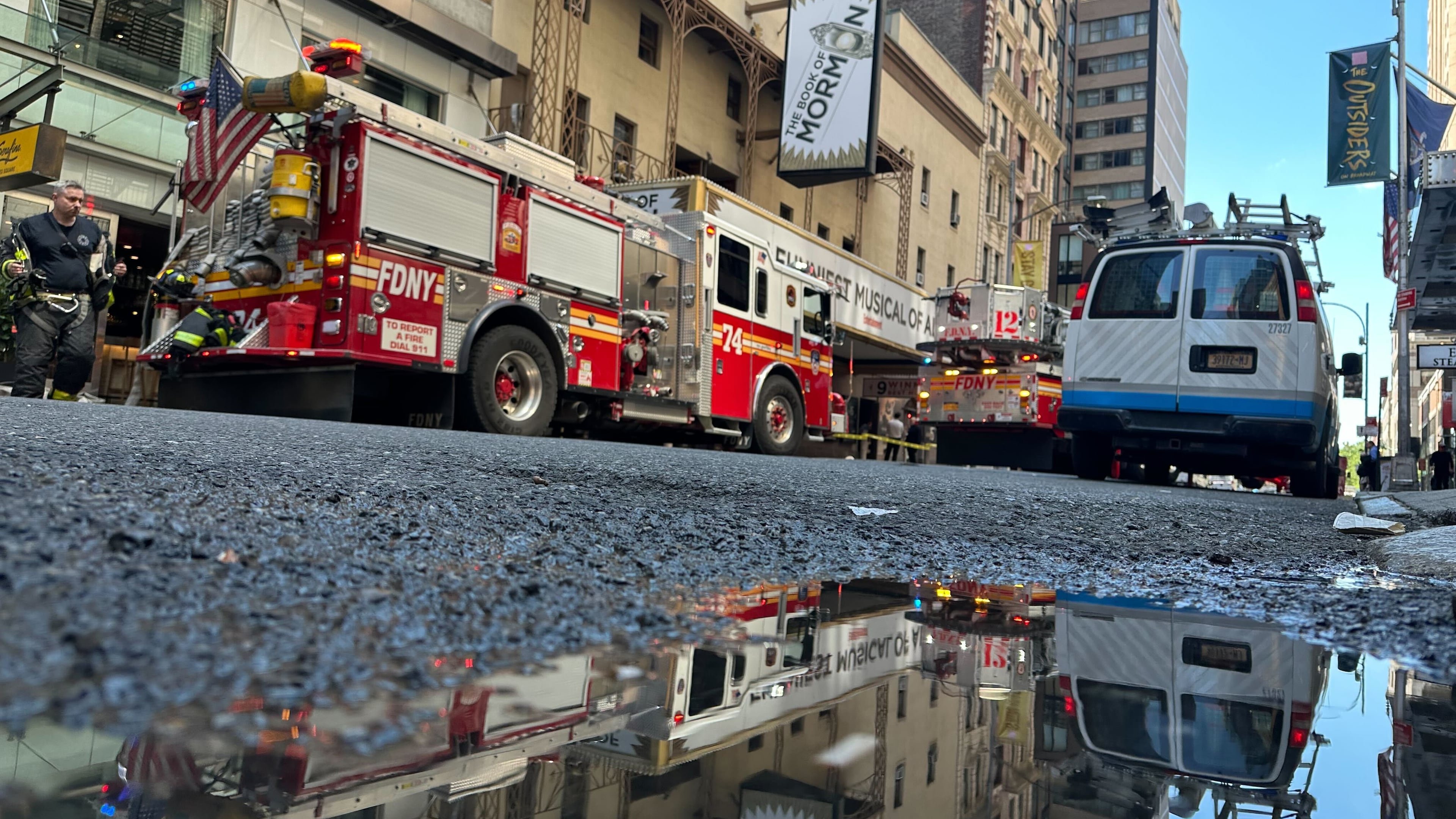 Firetrucks are parked outside of the Eugene O'Neill Theatre in New York on Monday, May 4, 2026. (AP Photo/David Martin)
