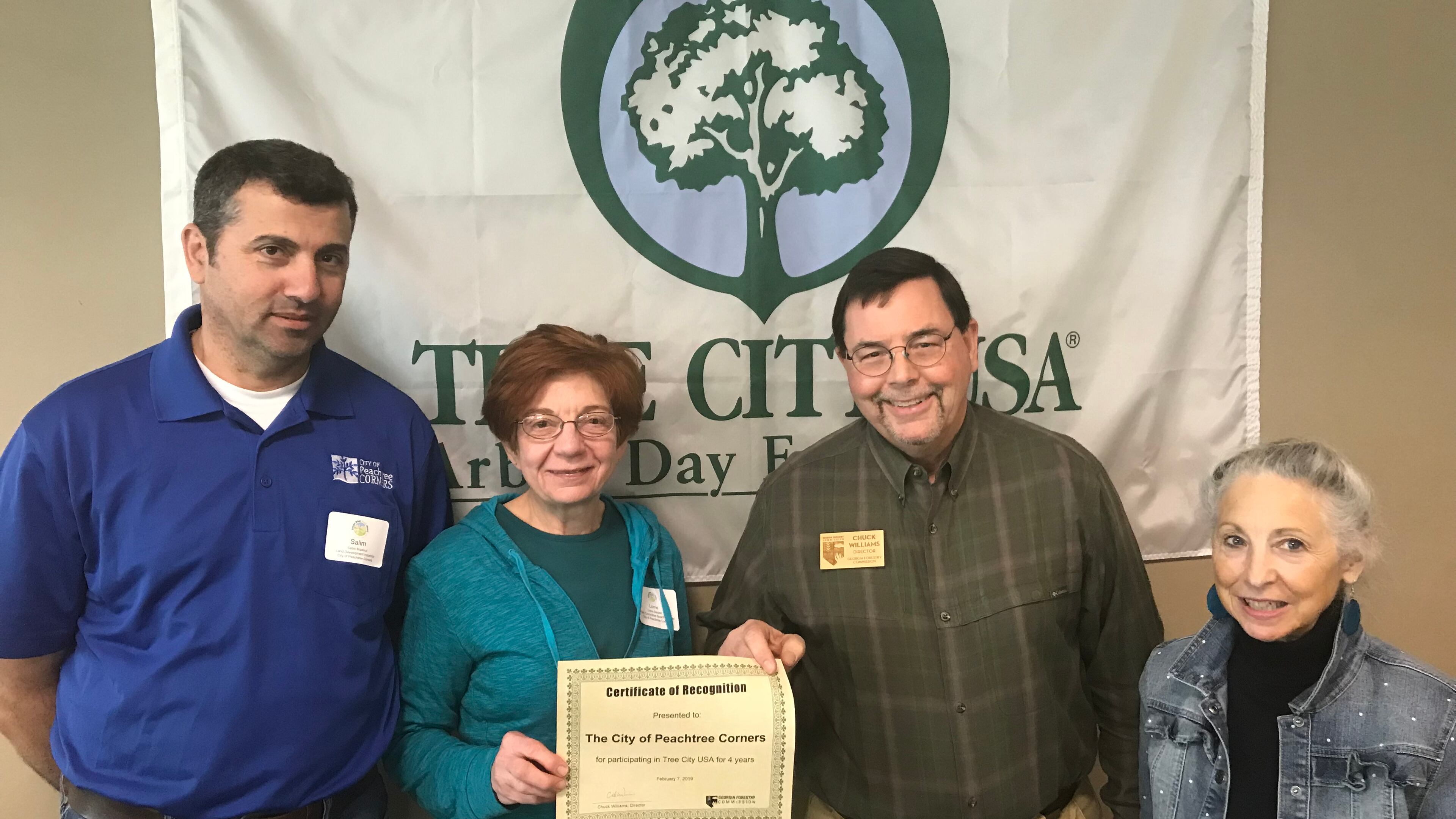 Peachtree Corners Land Development Inspector Salim Maalouf, resident Lorrie Backer, Georgia Forestry Commission Director Chuck Williams and resident and Master Gardener Hilary Wilson receive the city’s ‘Tree City USA’ honors. (Courtesy City of Peachtree Corners)