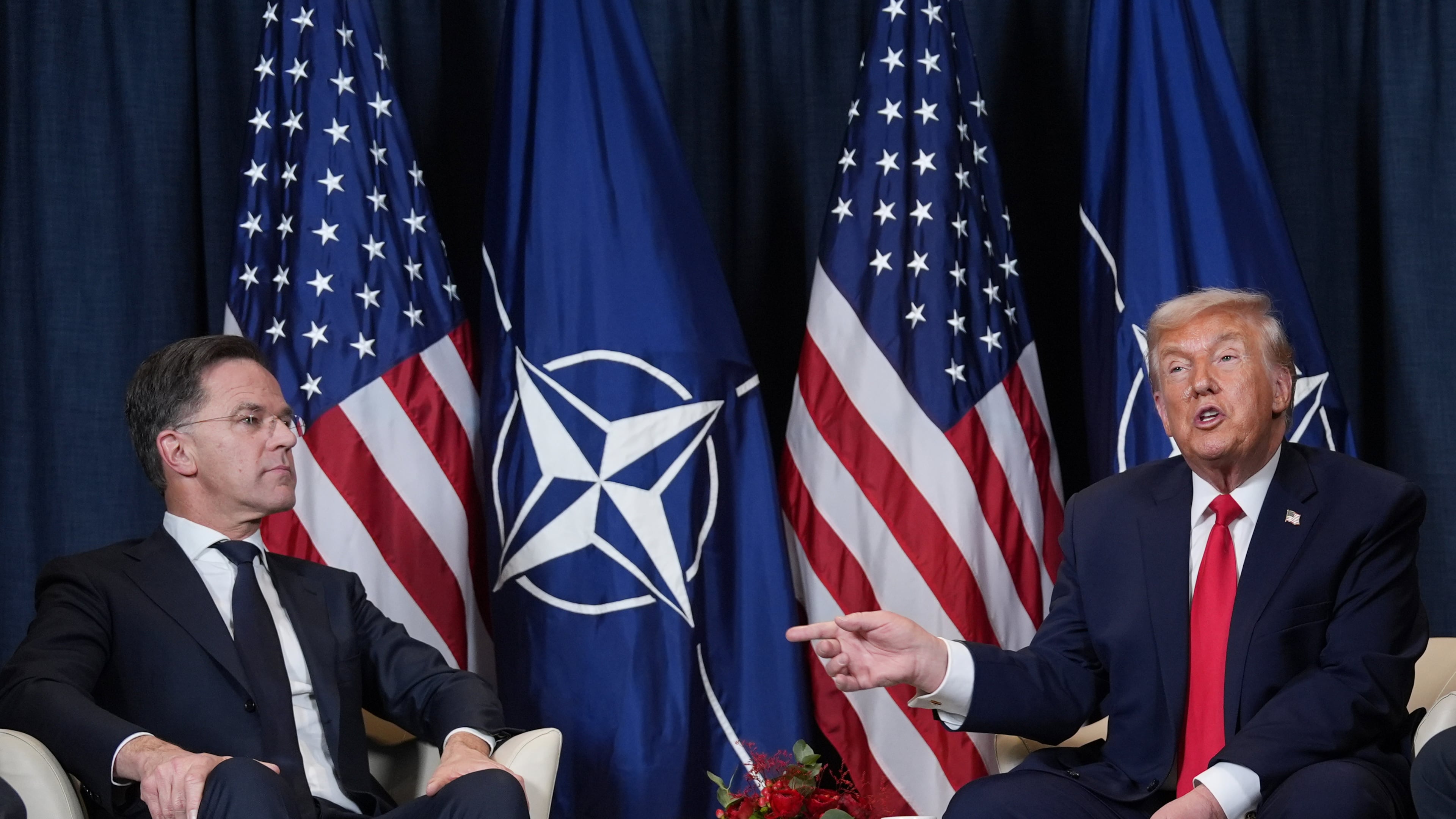 FILE - President Donald Trump, right, meets with NATO Secretary General Mark Rutte on the sidelines of the Annual Meeting of the World Economic Forum in Davos, Switzerland, Jan. 21, 2026. (AP Photo/Evan Vucci, File)