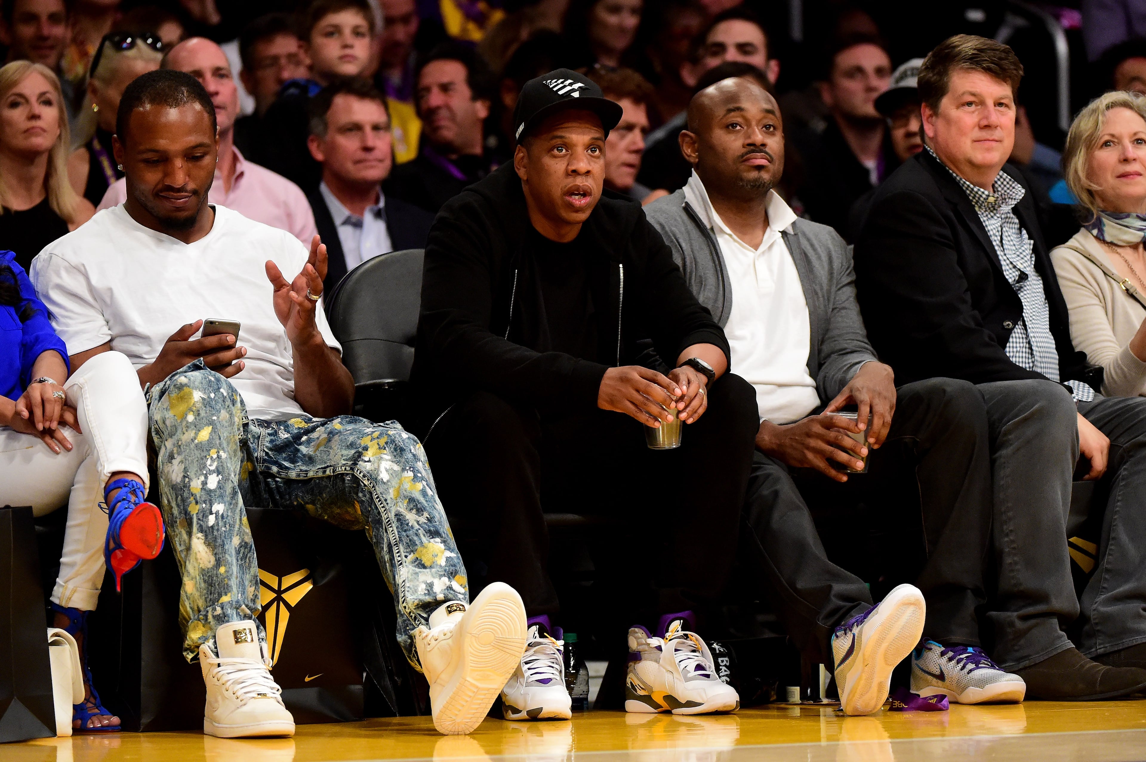 Jay-Z smiles as he sits courtside as the Los Angeles Lakers take on the Utah Jazz at Staples Center on April 13, 2016 in Los Angeles, California. (Photo by Harry How/Getty Images)
