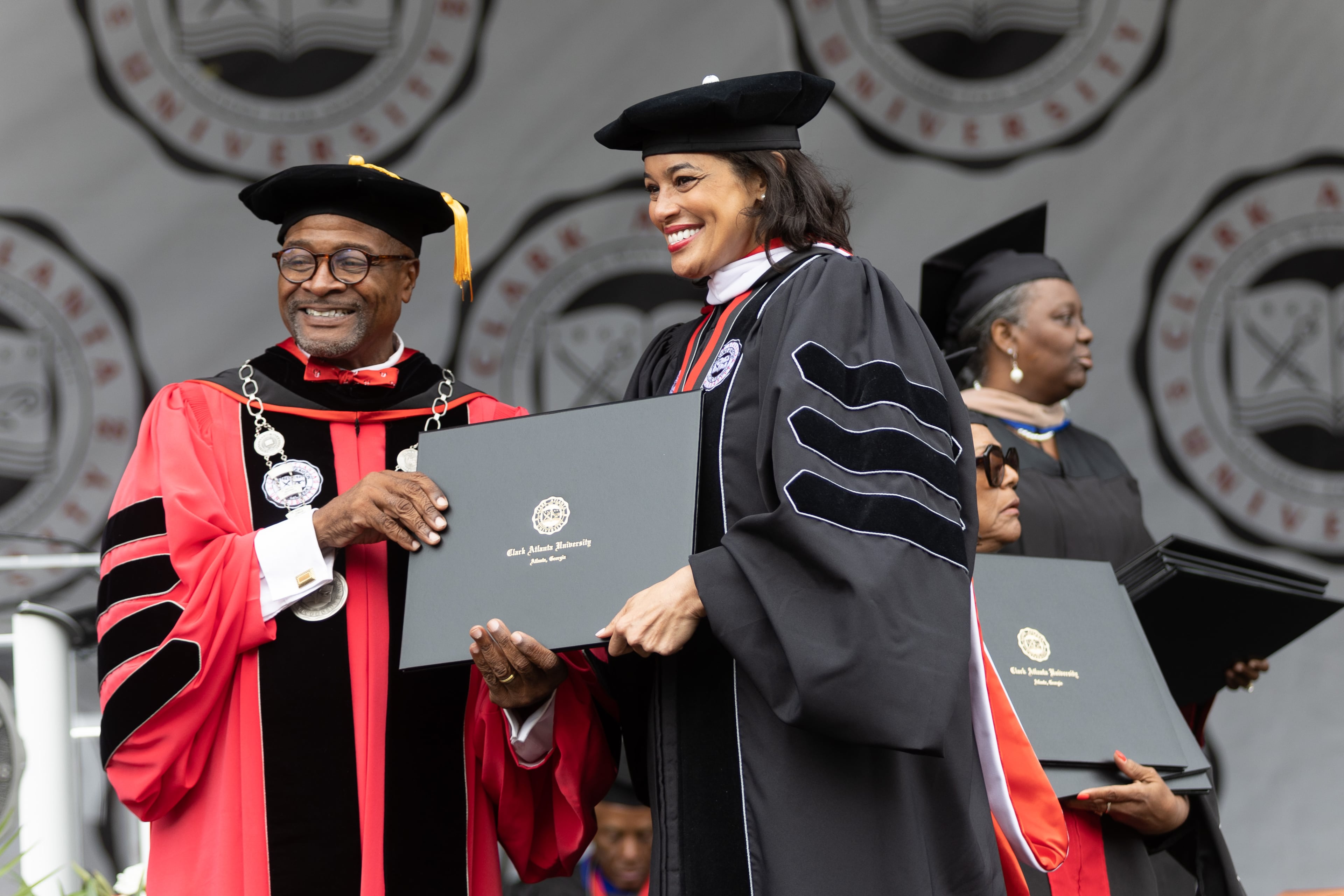 Clark Atlanta University President George T French Jr. poses for photographs with the graduates after they received their diplomas at the commencement ceremony in Panther Stadium on Saturday, May 20, 2023. (Steve Schaefer / steve.schaefer@ajc.com)